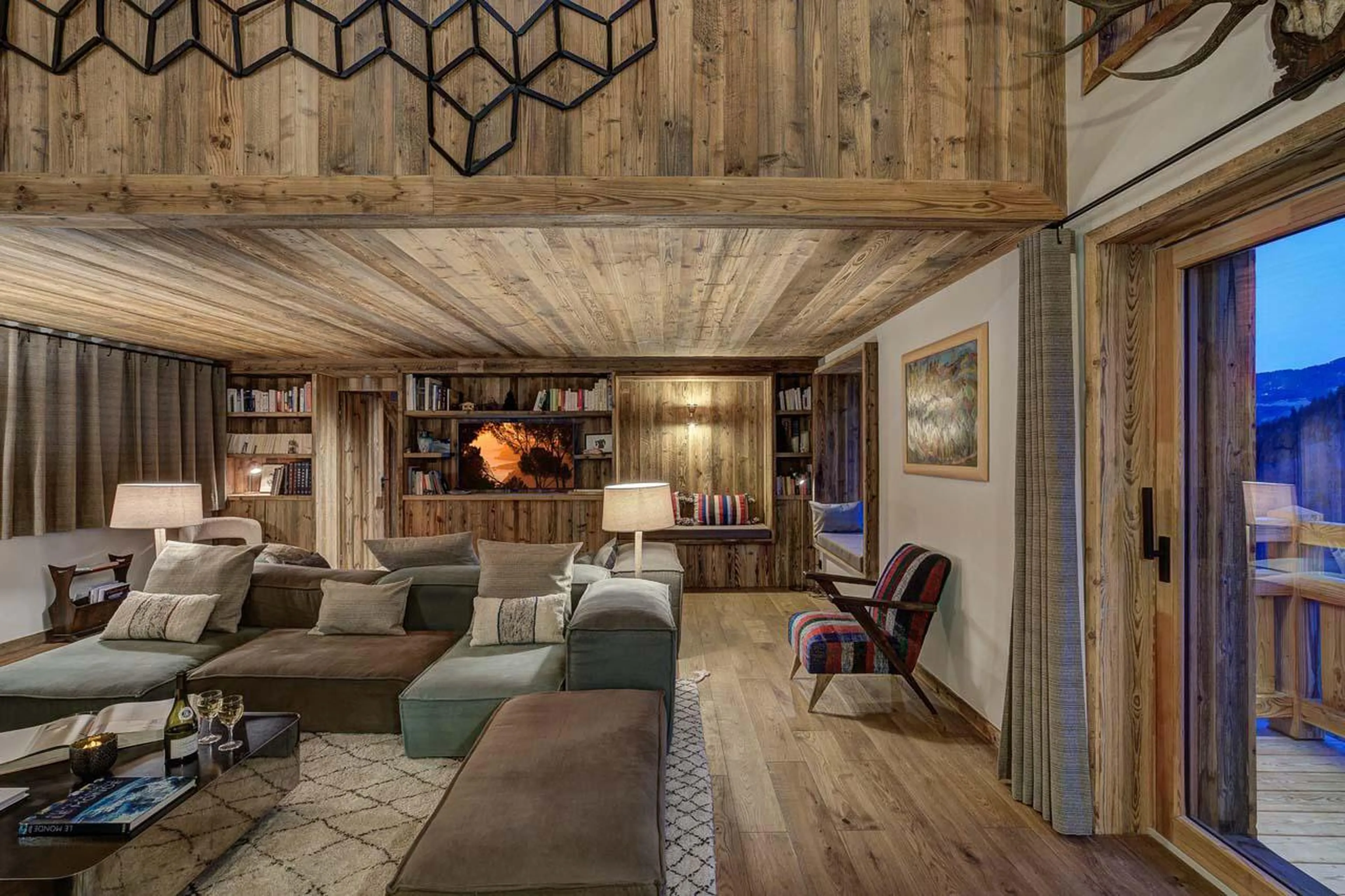 Living area opening out onto outdoor terrace at Chalet Bergeronnette in Meribel