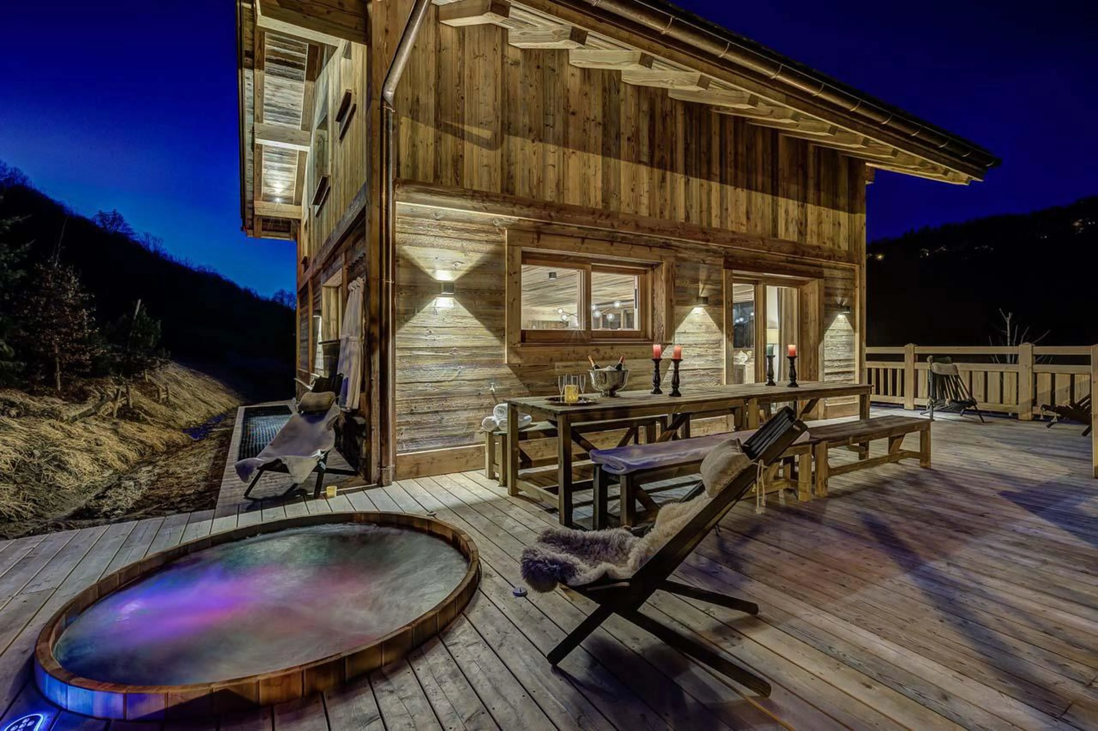 Outdoor hot tub at night at Chalet Bergeronnette in Meribel
