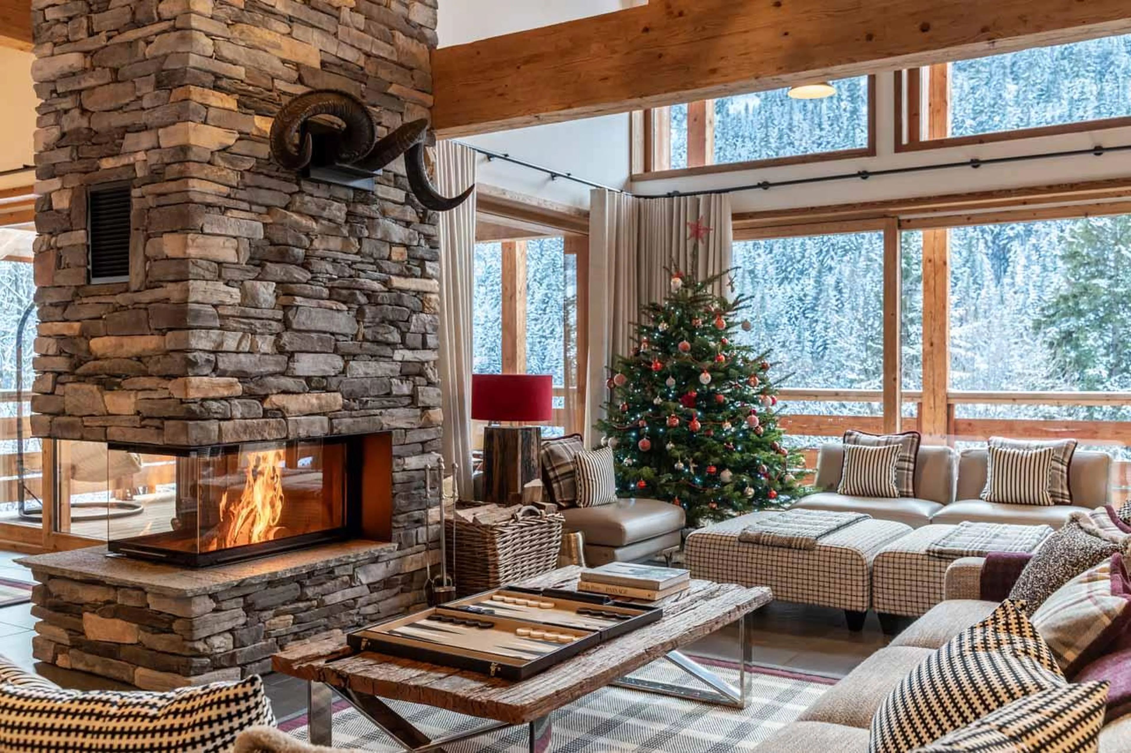 Living area with fireplace at Chalet Berlioz in Meribel