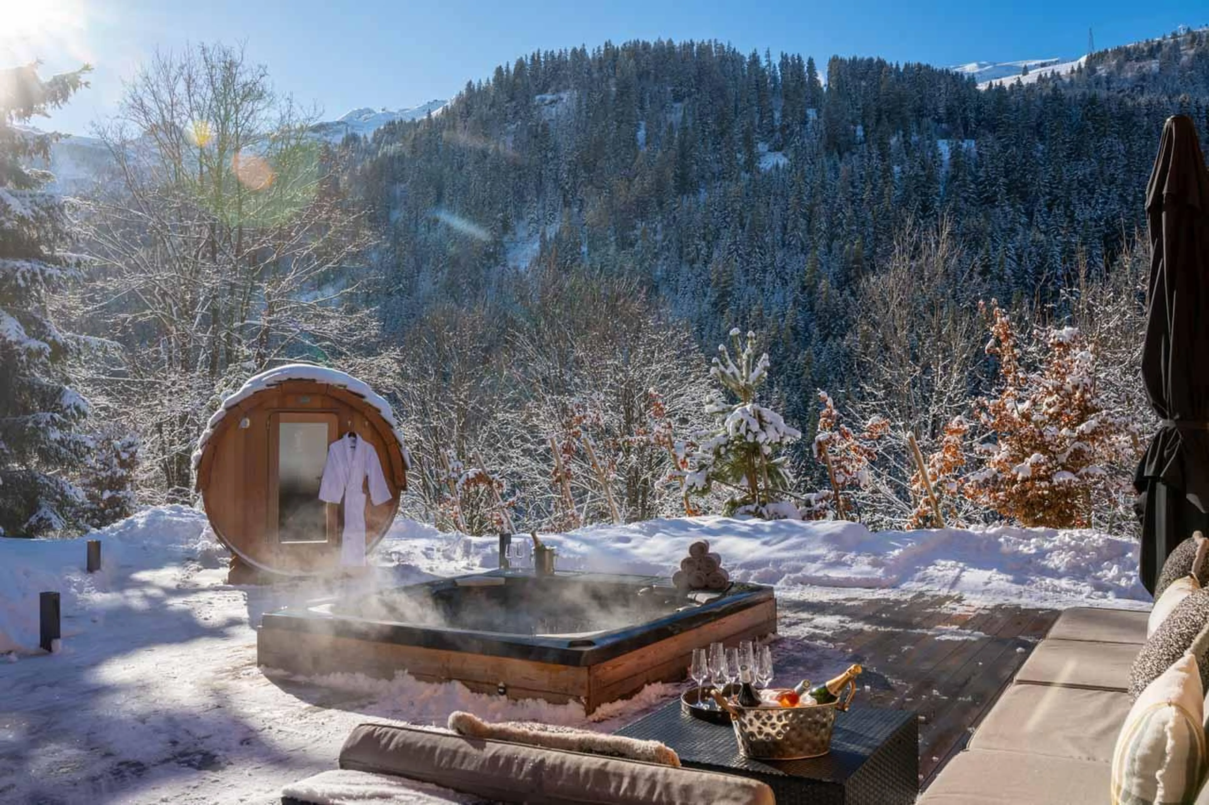 Hot tub and sauna located on the outdoor terrace at Chalet Berlioz in Meribel