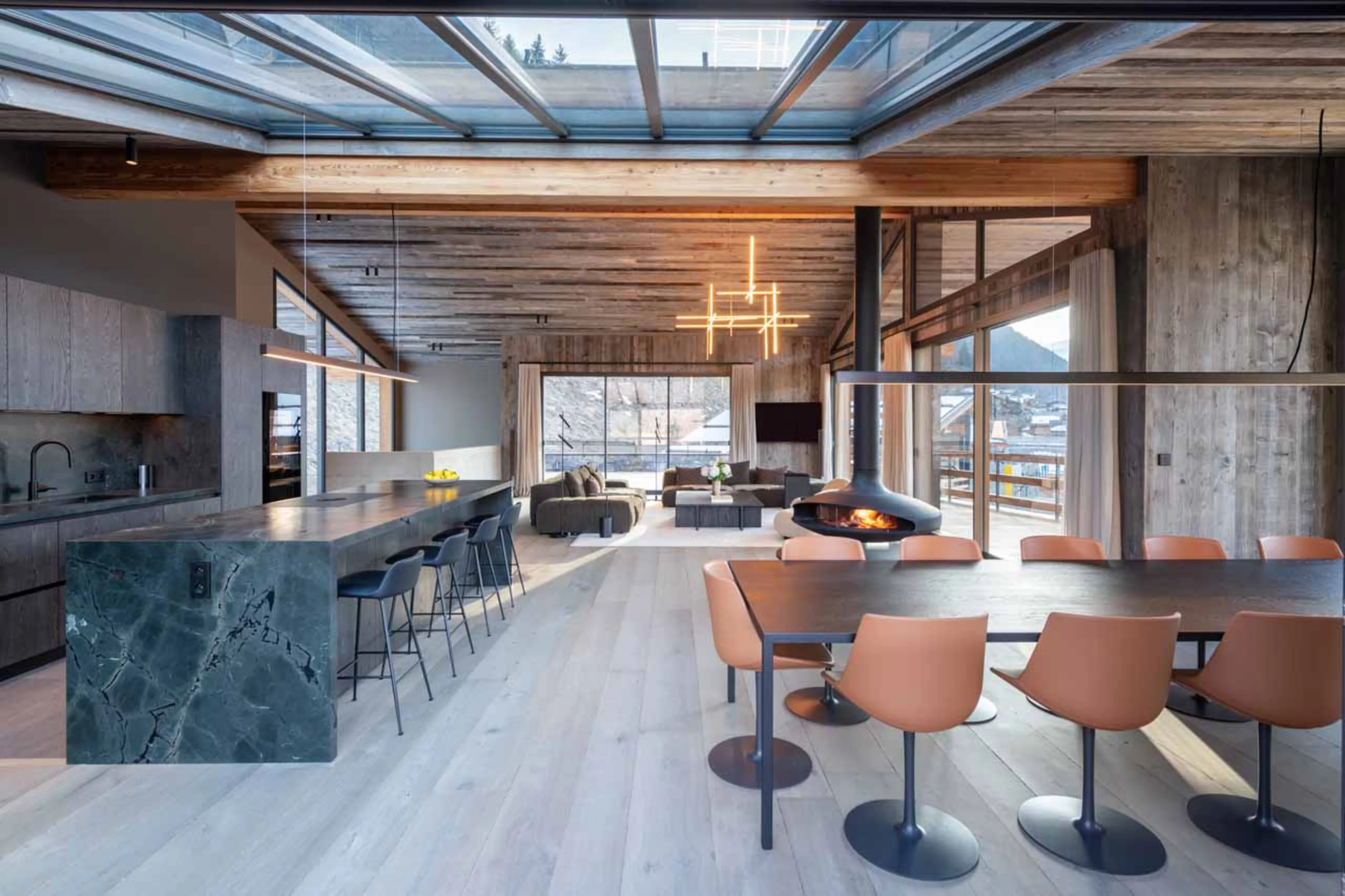 Dining table and kitchen at Chalet Bisou in Morzine