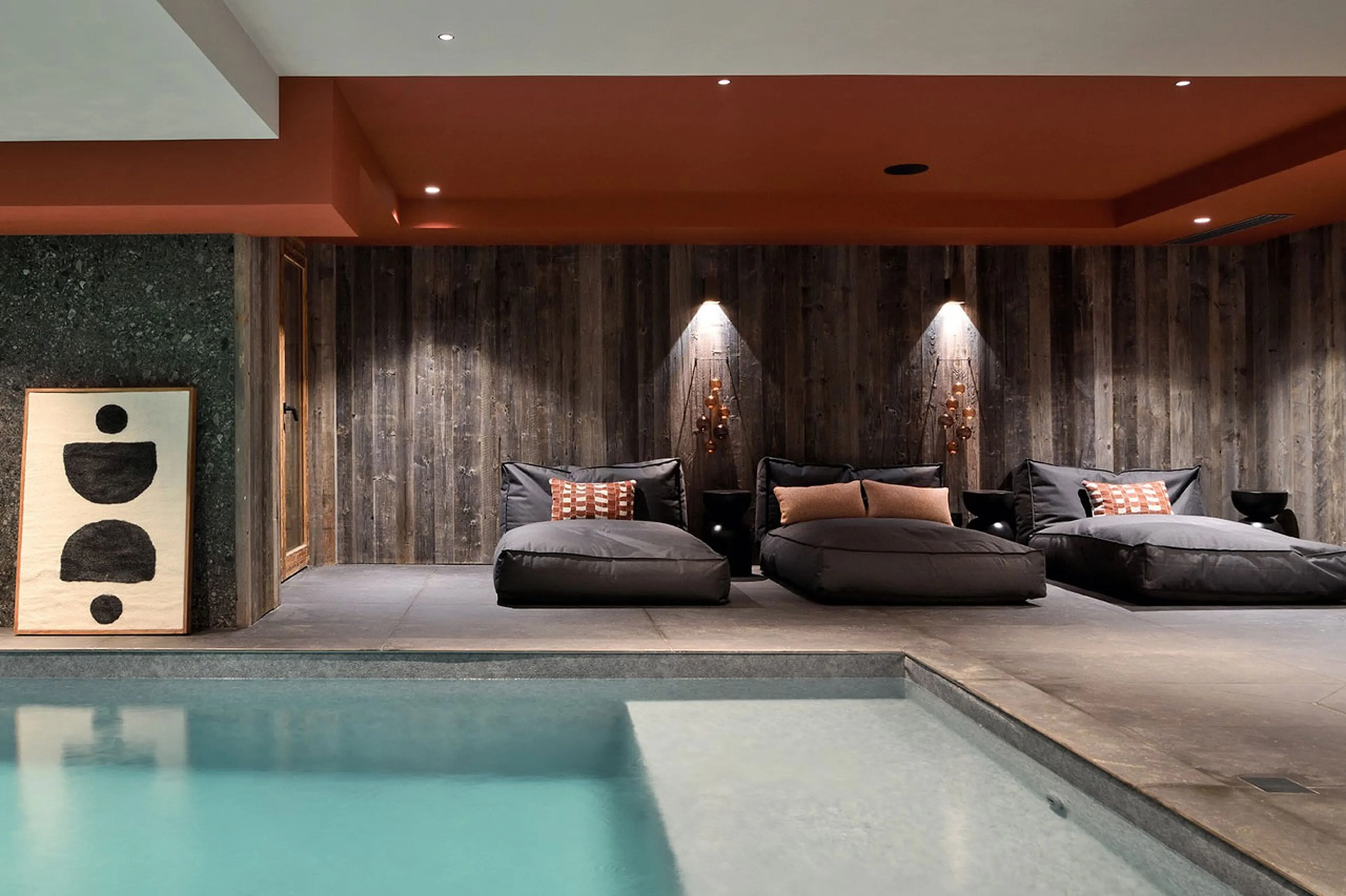 Poolside seating at Chalet Black Peak in Meribel