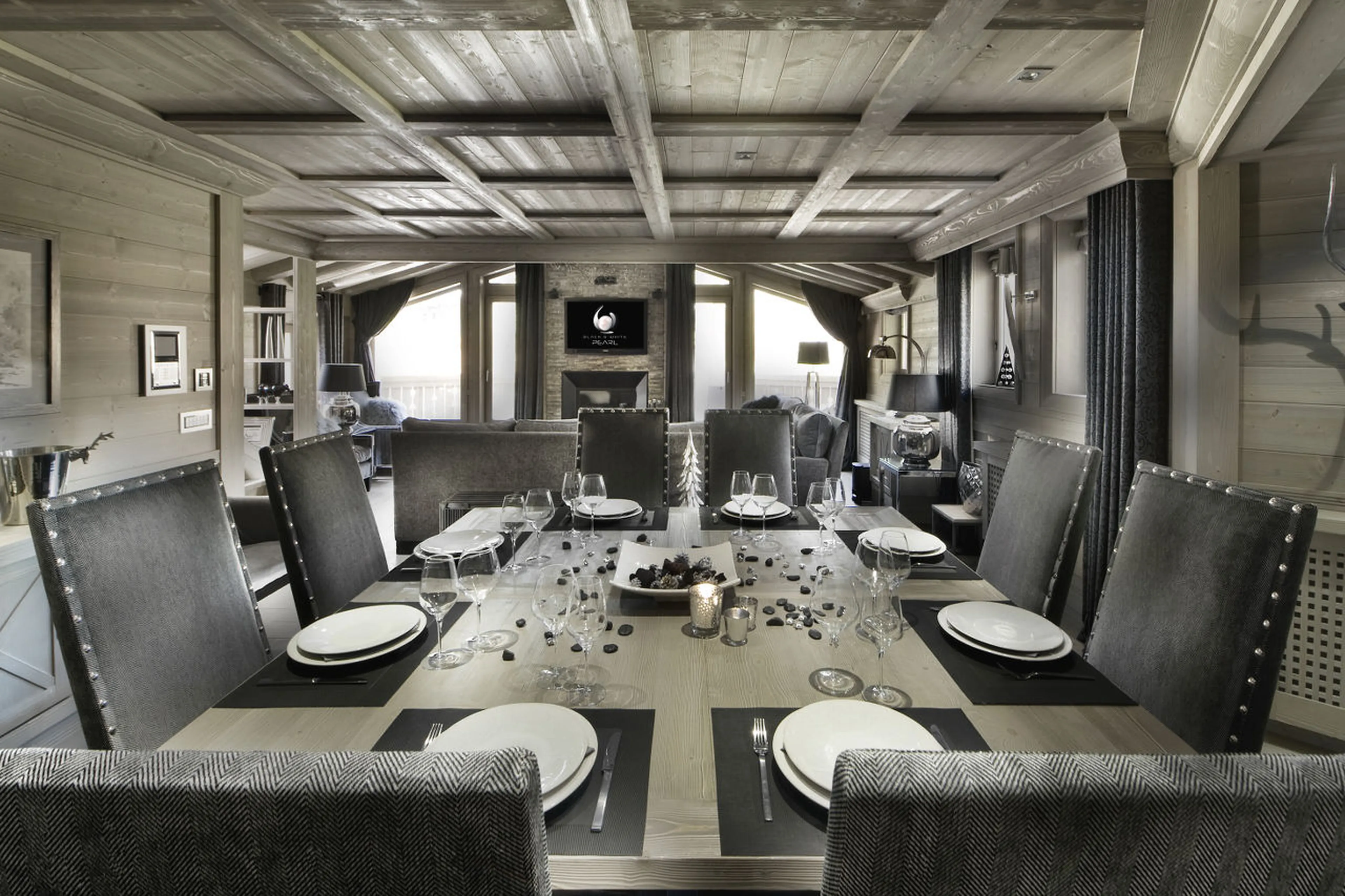 Solid wood dining table in living area of Chalet Black Pearl in Val d’Isere
