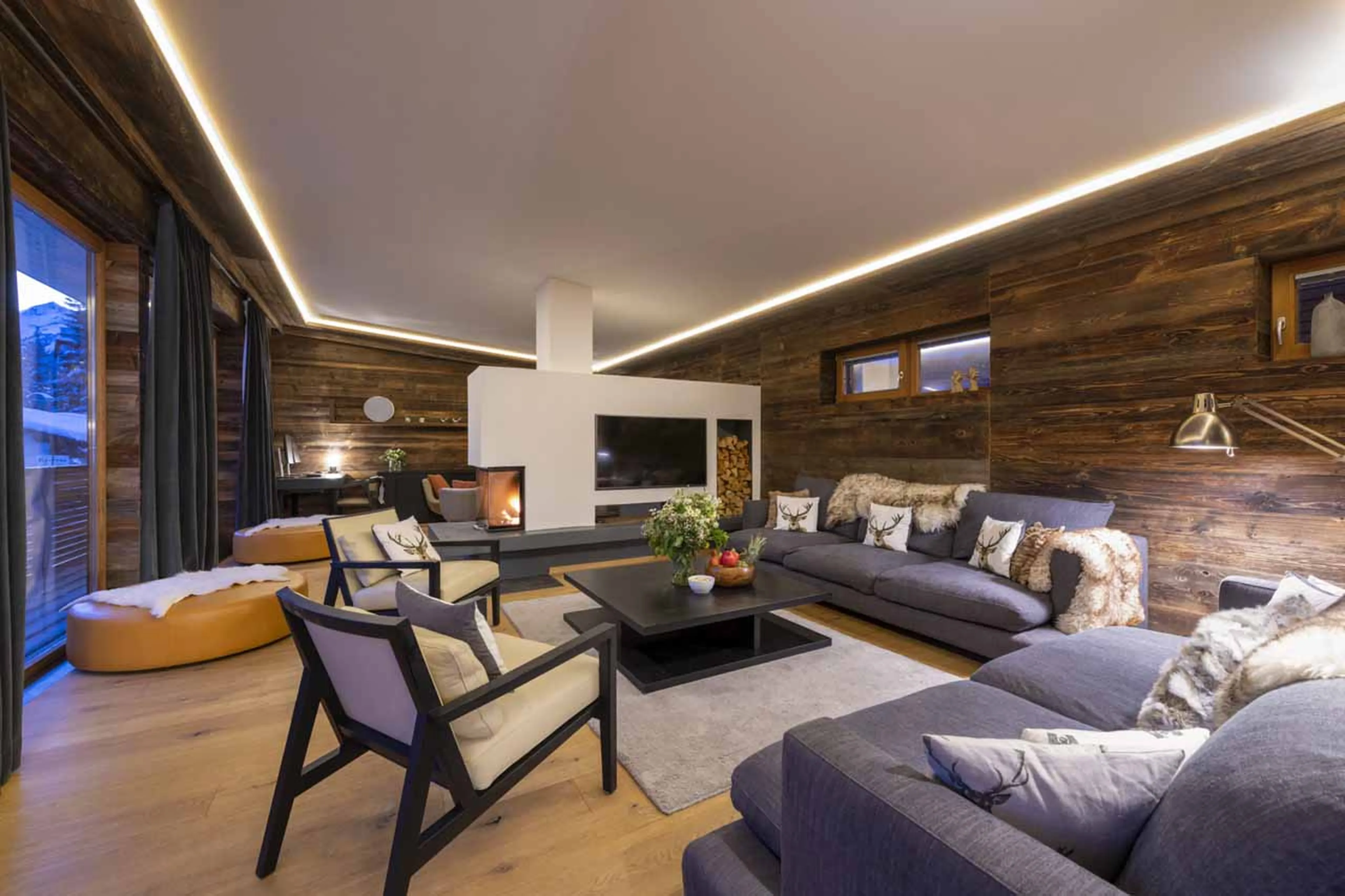 Living area at night at Chalet Bluebird in St Anton