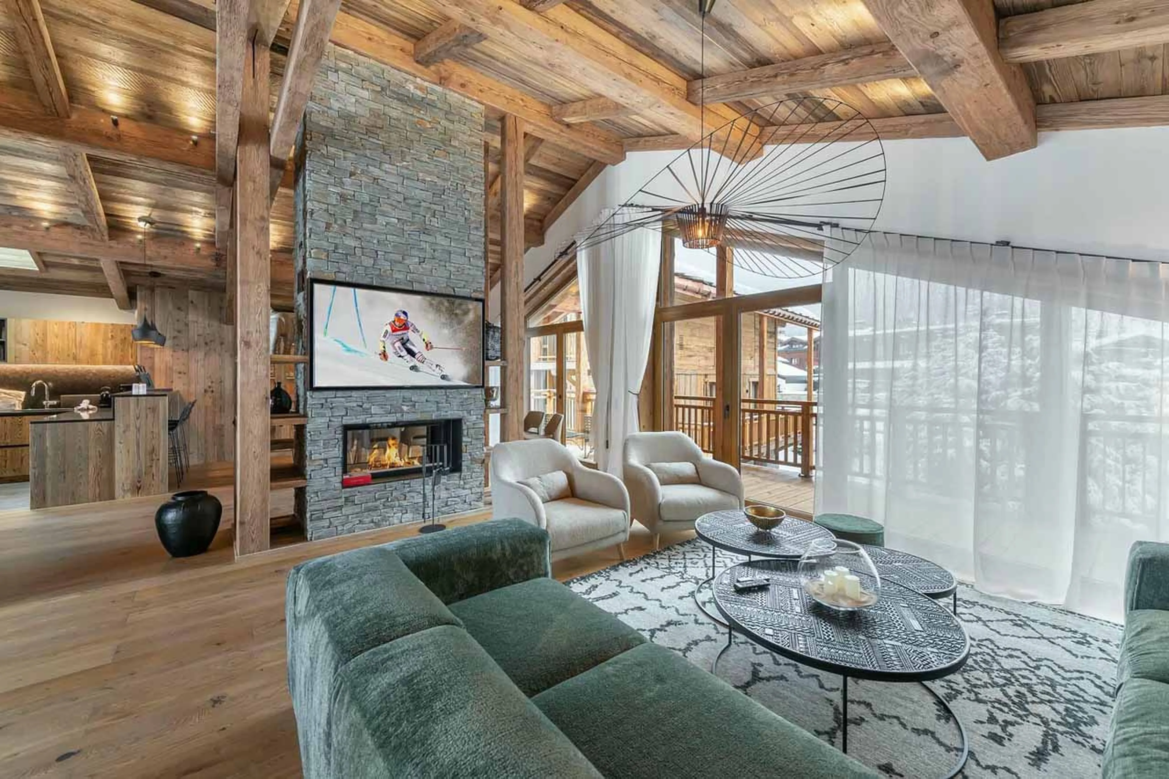 Fireplace in living area at Chalet Bois du Ban in Courchevel Le Praz