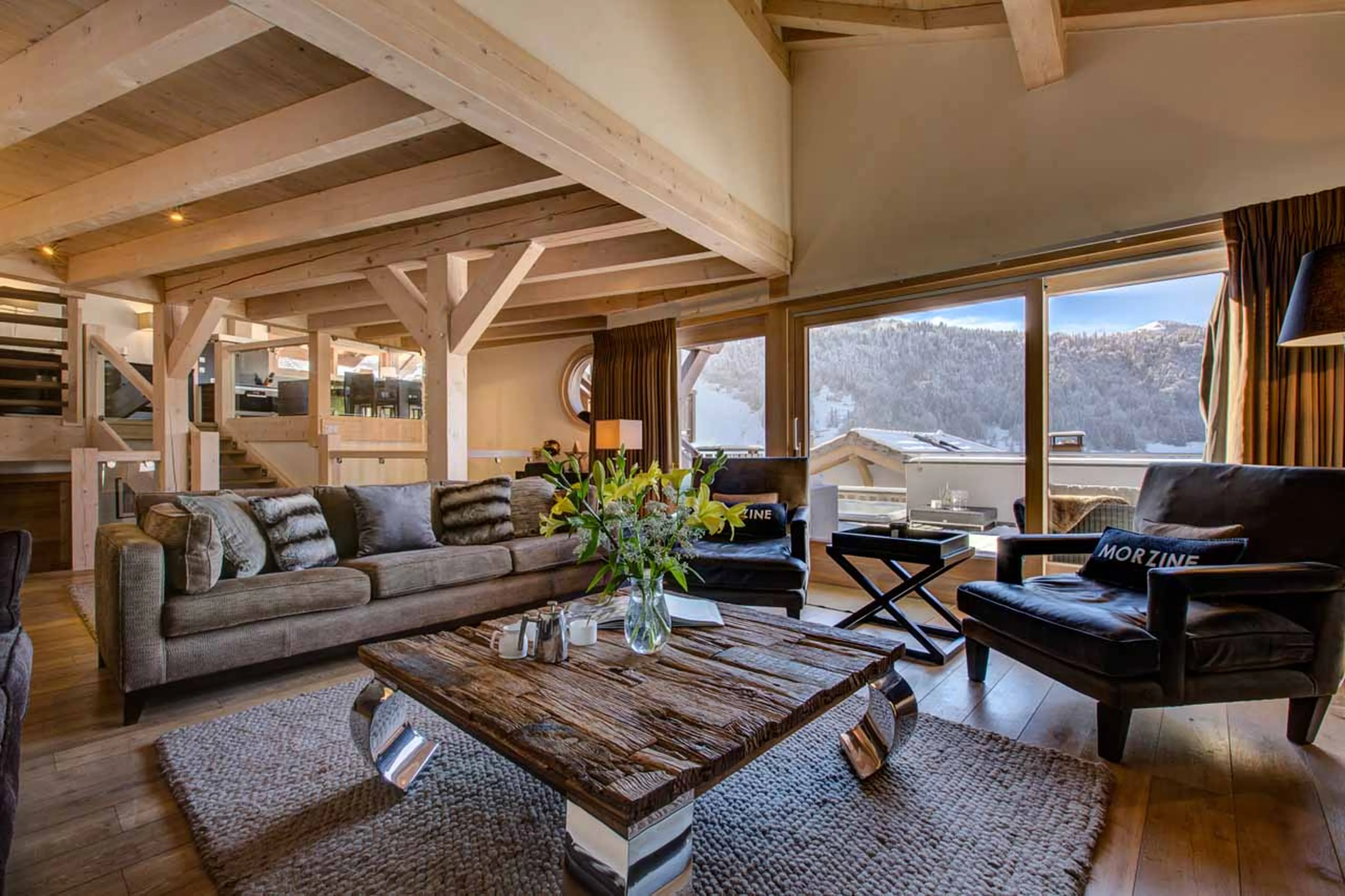 Doors open onto terrace from living area of Chalet Bouquetin in Morzine