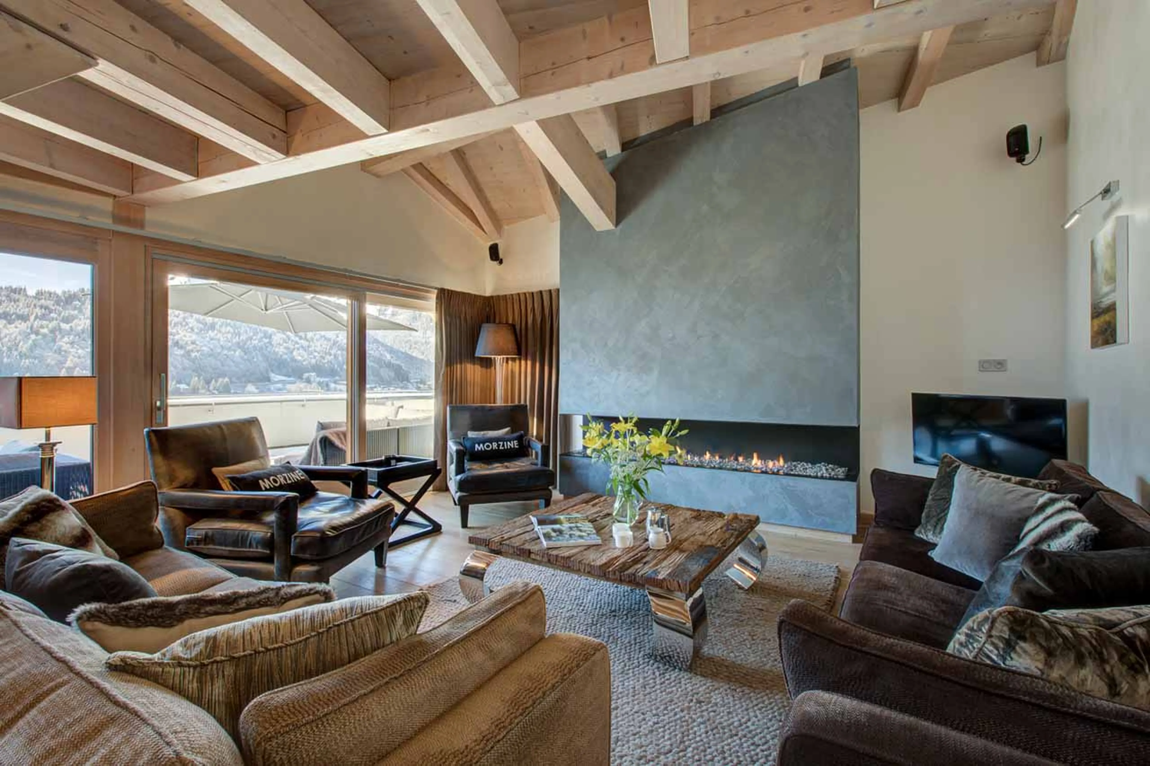 TV and fireplace in living room of Chalet Bouquetin in Morzine