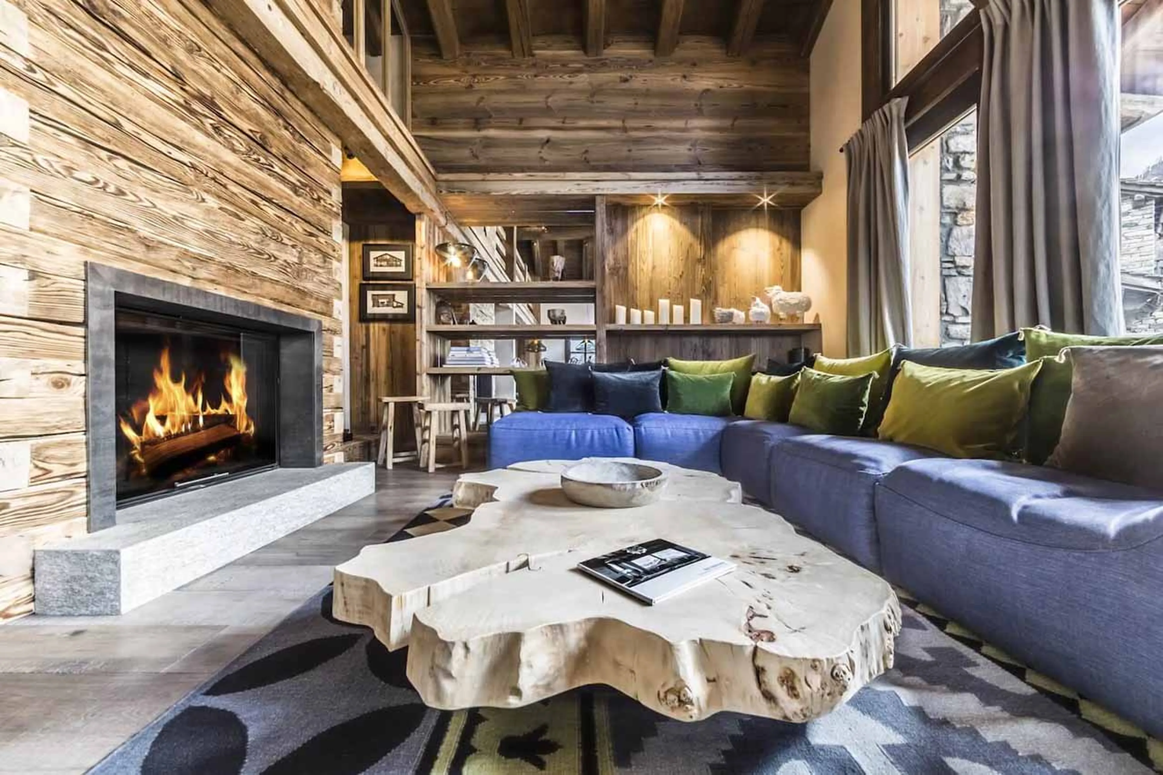 Cosy living area with fireplace at Chalet Calistoga in Val d'Isere