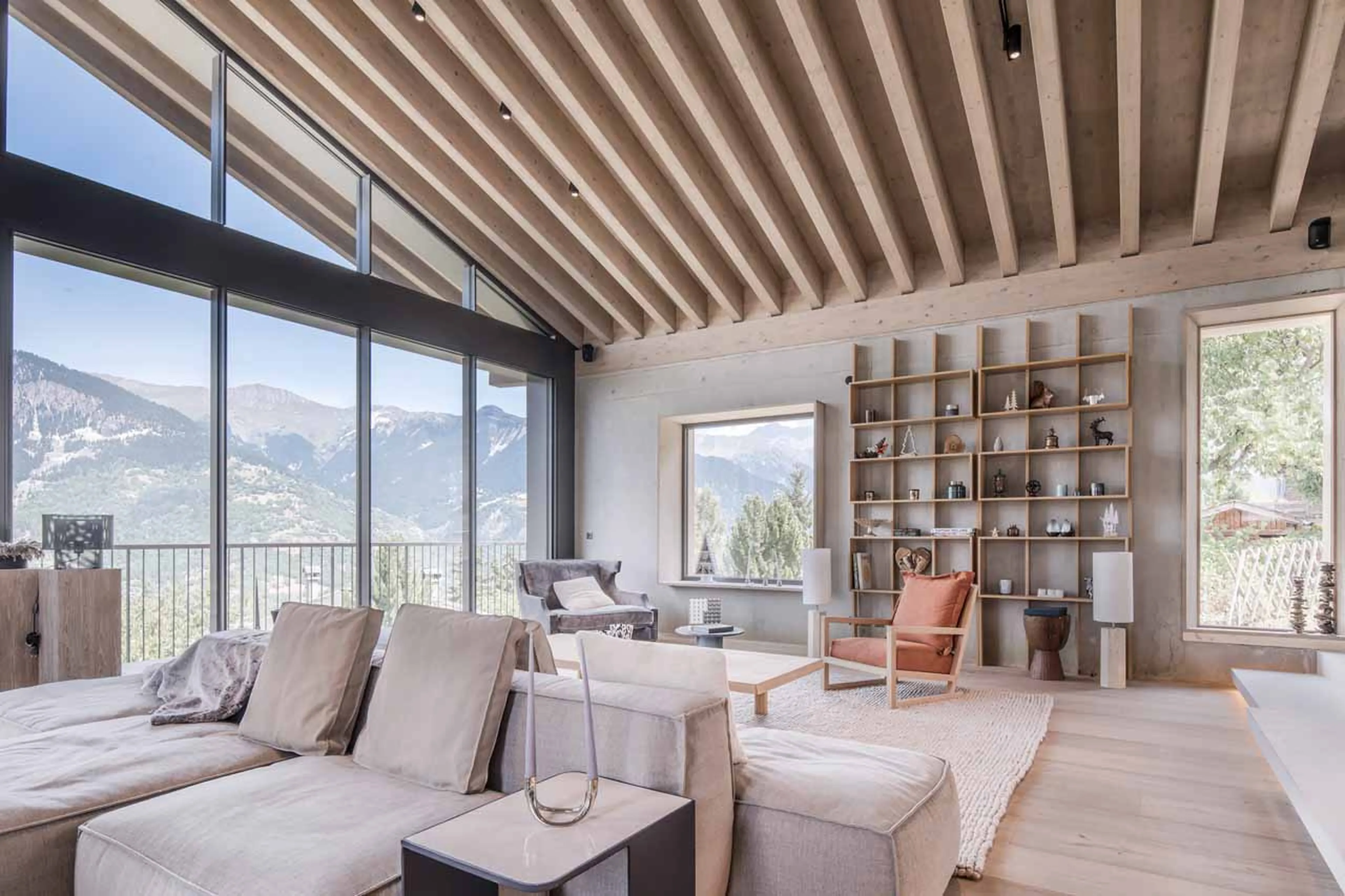 Floor to ceiling windows in living area at Chalet Celeste in Courchevel Le Praz