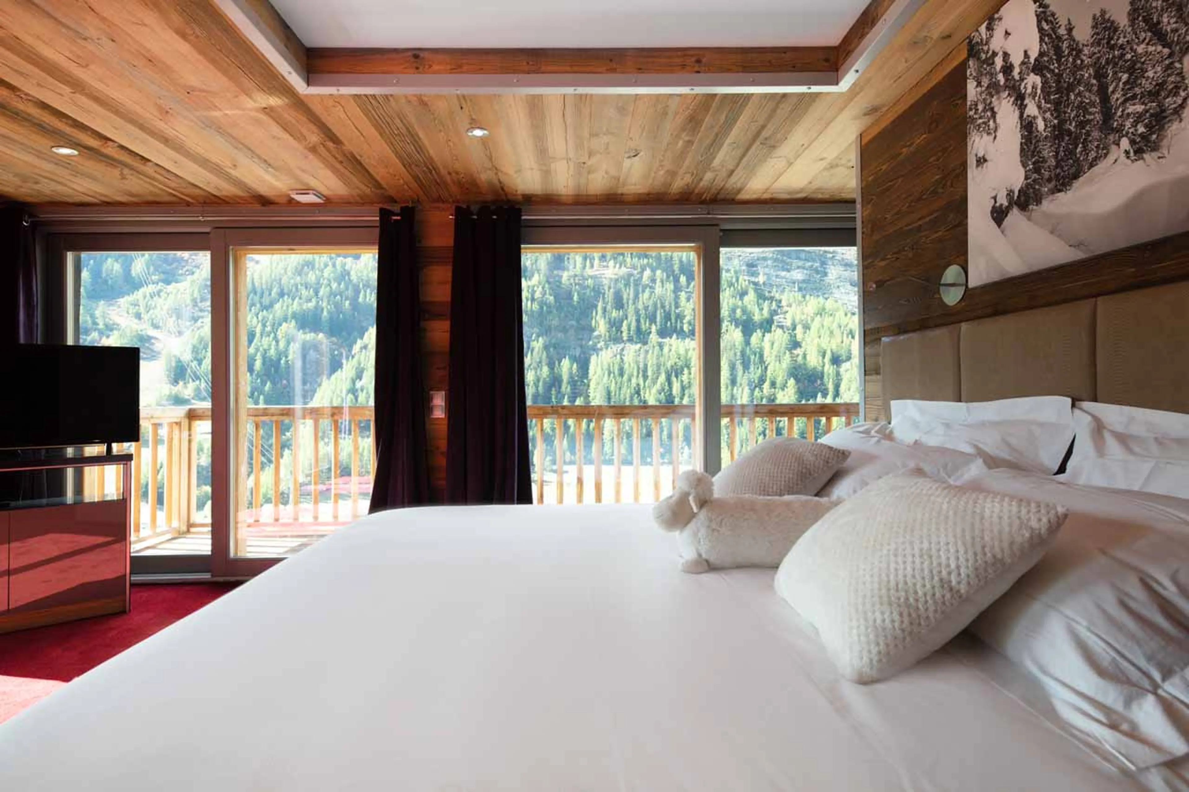 TV in bedroom one at Chalet Charlie in Tignes