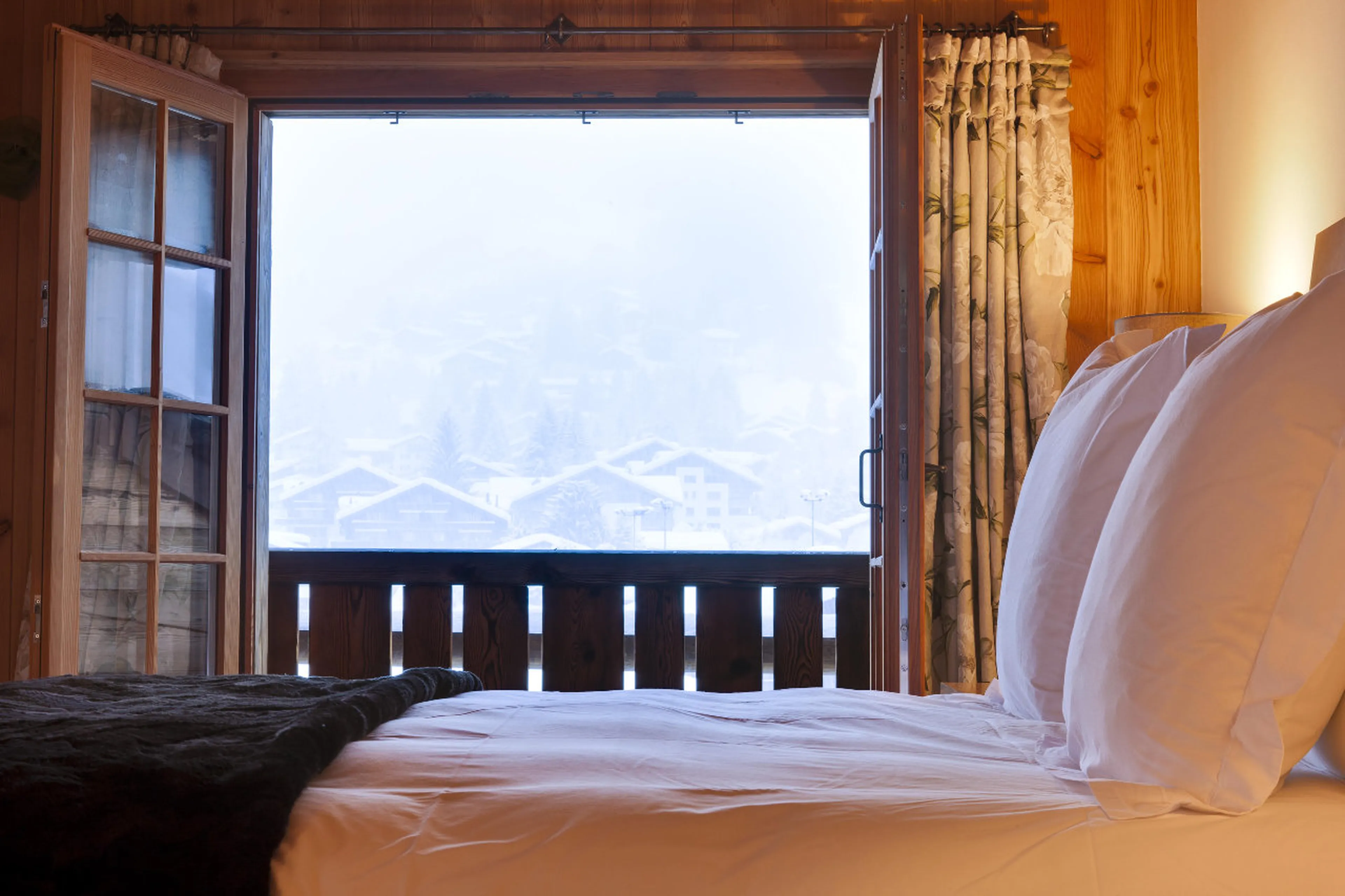 Master bedroom has balcony access in Chalet Chimera in Klosters
