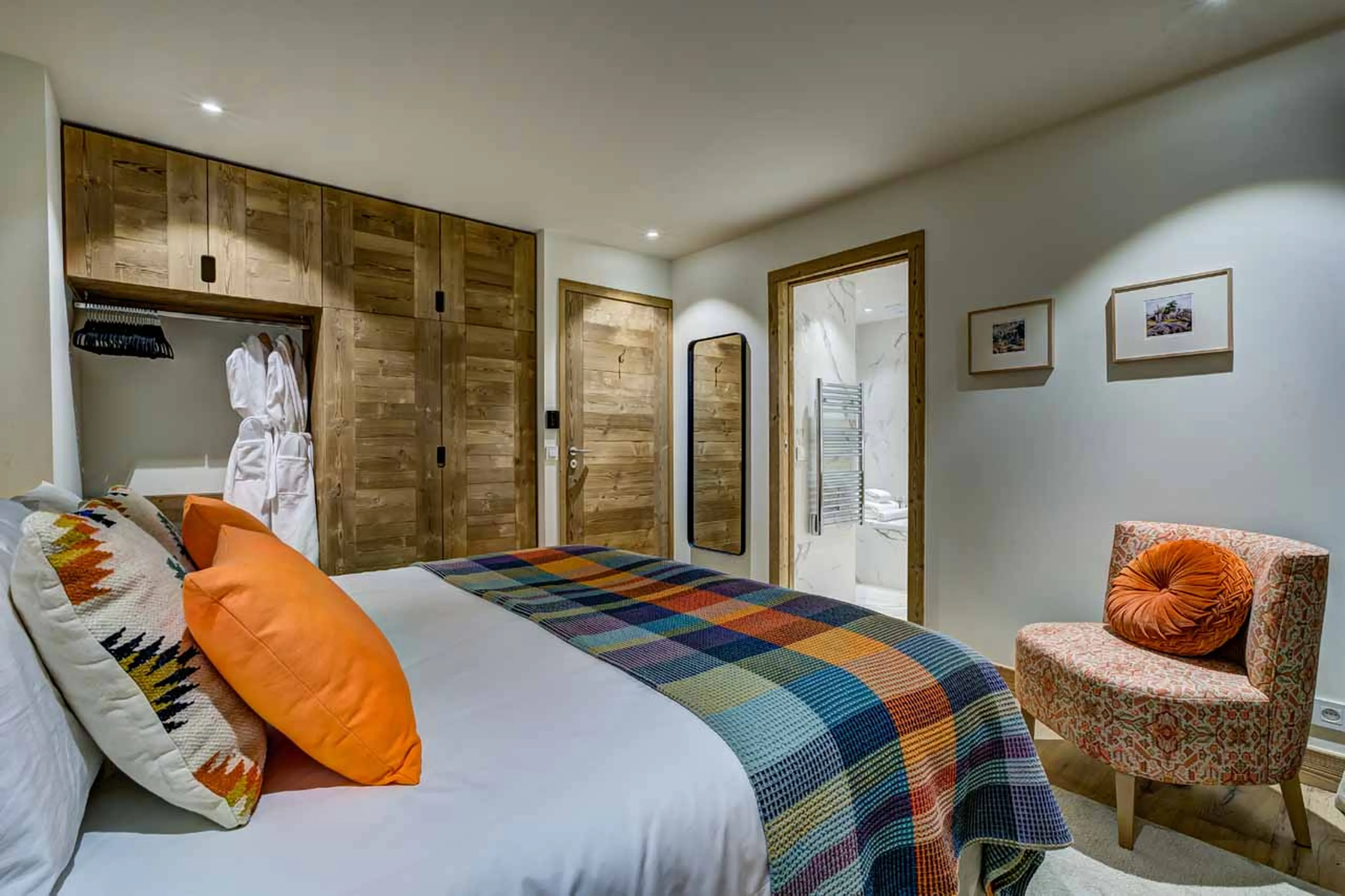 Desk and armchair in bedroom four at Chalet Constantia in St Martin de Belleville