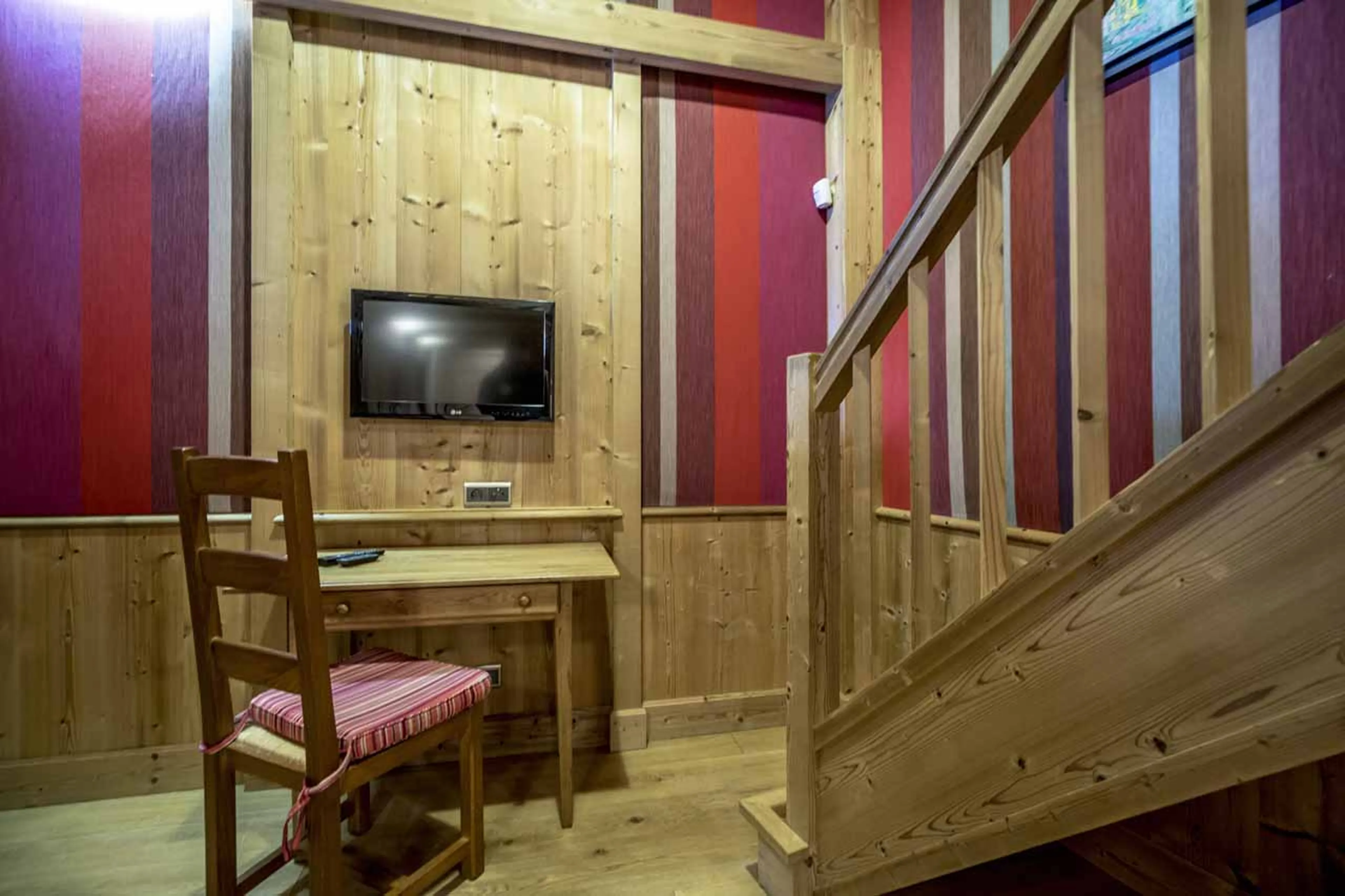 Stairs leading to mezzanine double bedroom at Chalet Cristal A in Val d’Isere