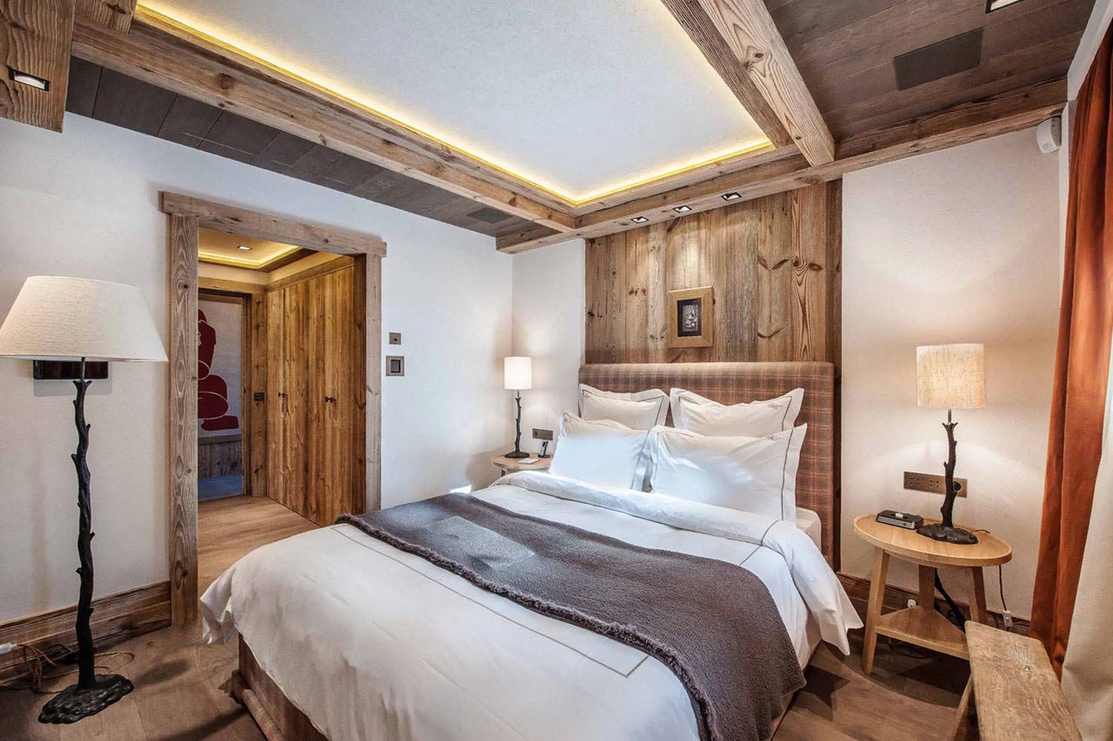 Bedroom with dressing area and en suite shower room in Chalet Cryst'Aile in Courchevel 1850