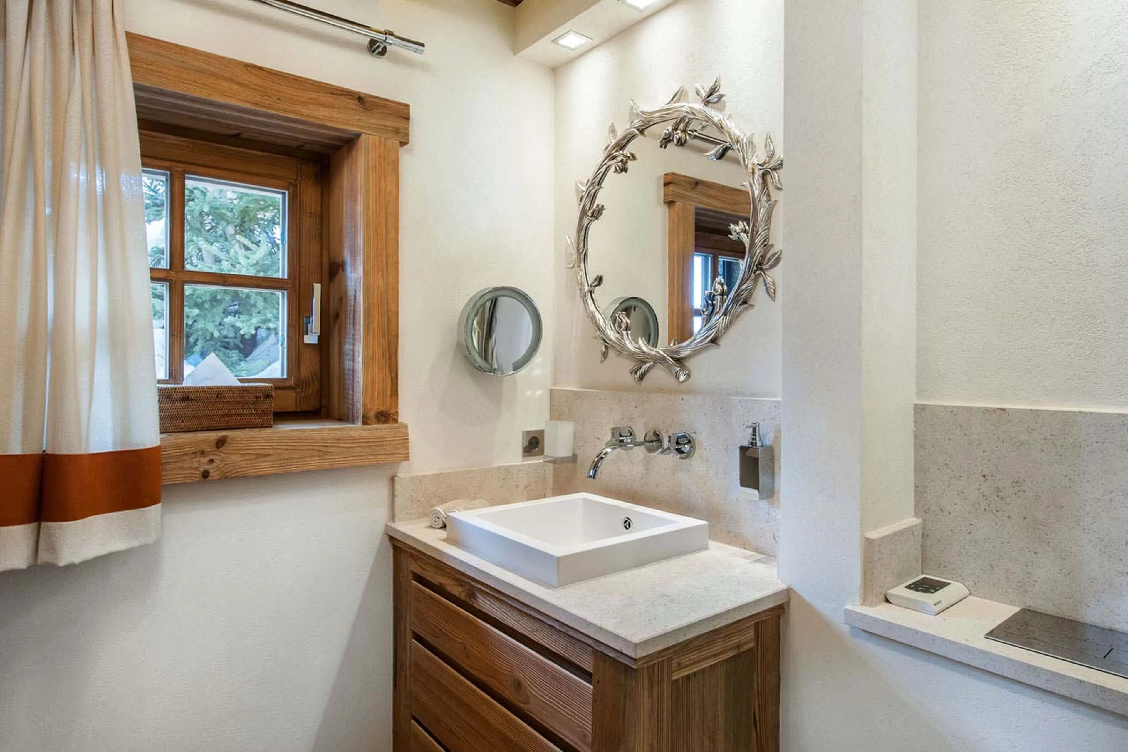 The shower room is en suite to a double bedroom in Chalet Cryst'Aile in Courchevel 1850
