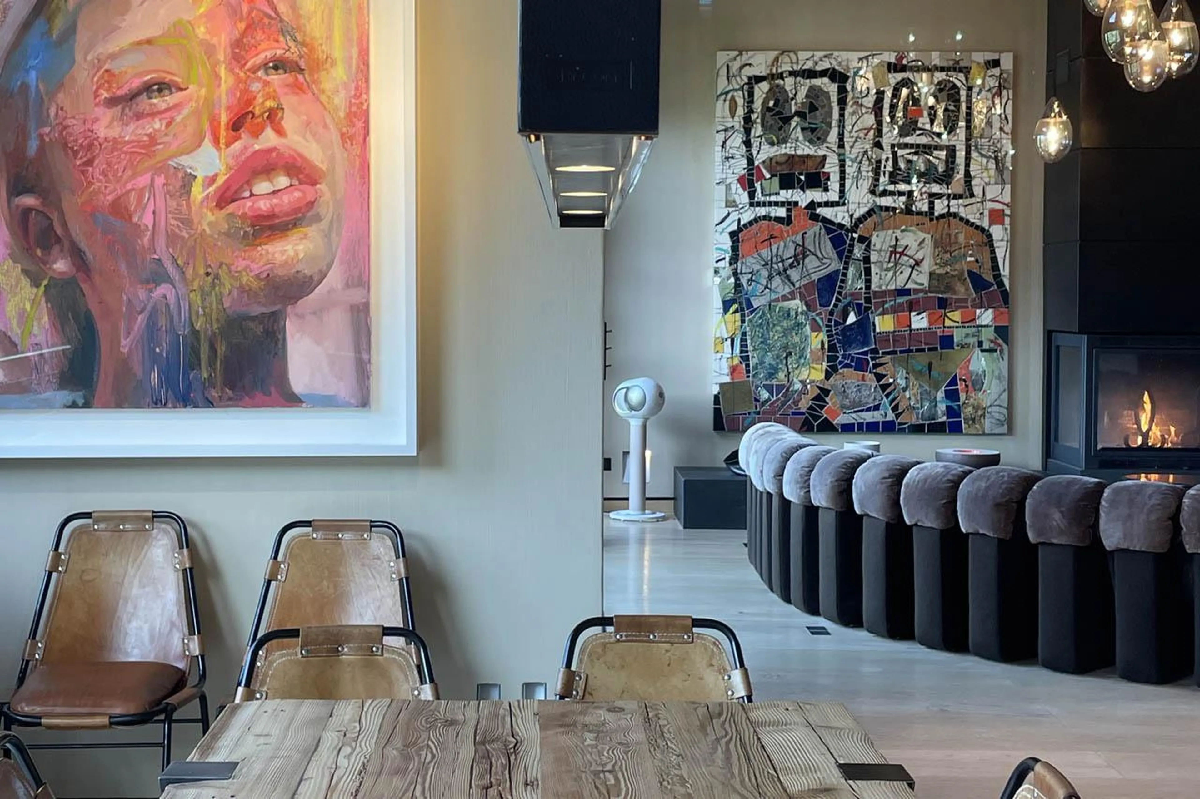 Dining table, sofas and fireplace at Chalet Cyanella in Megeve