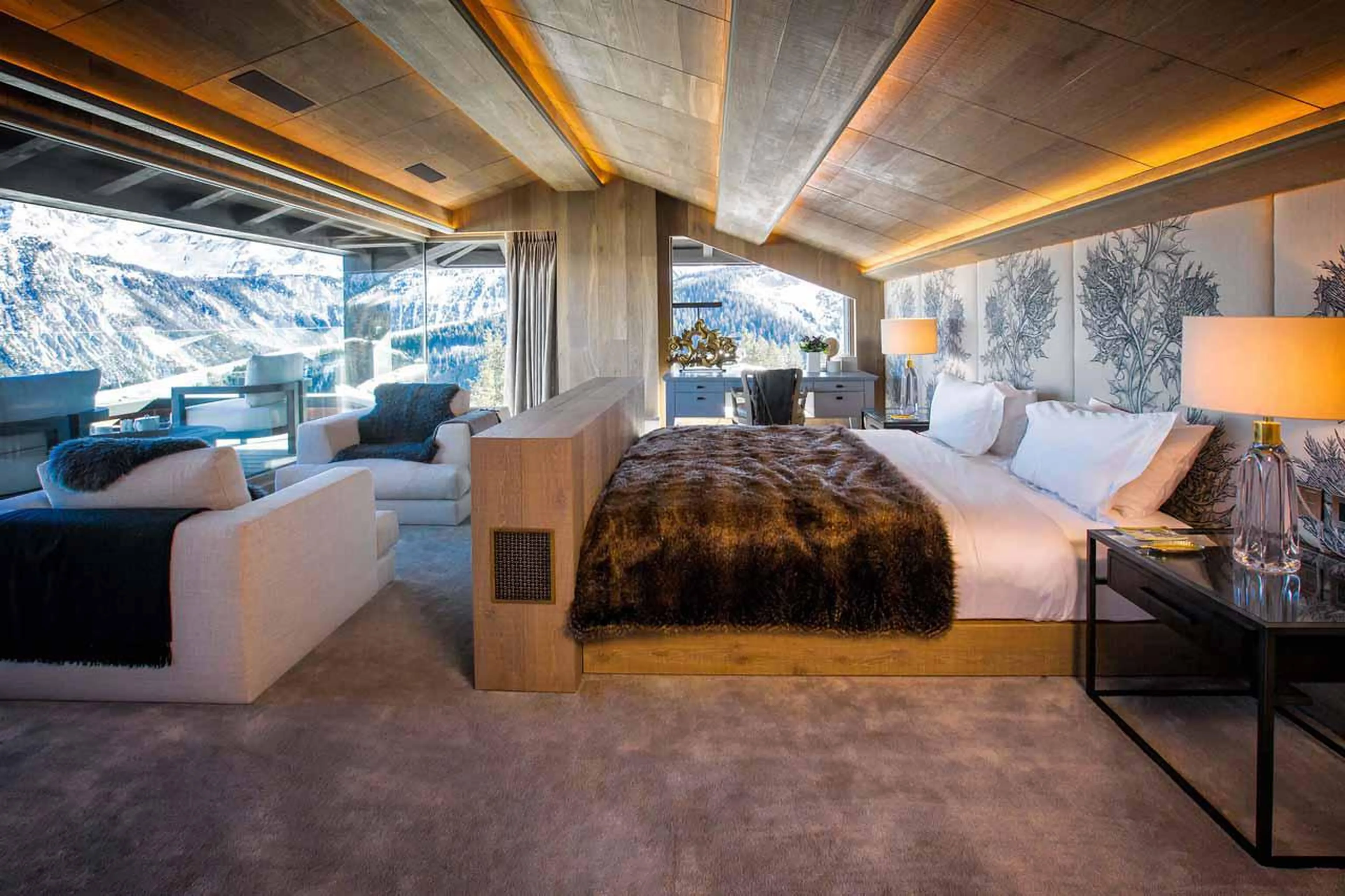 Master suite with armchairs in Chalet d'Ecosse, Courchevel 1850