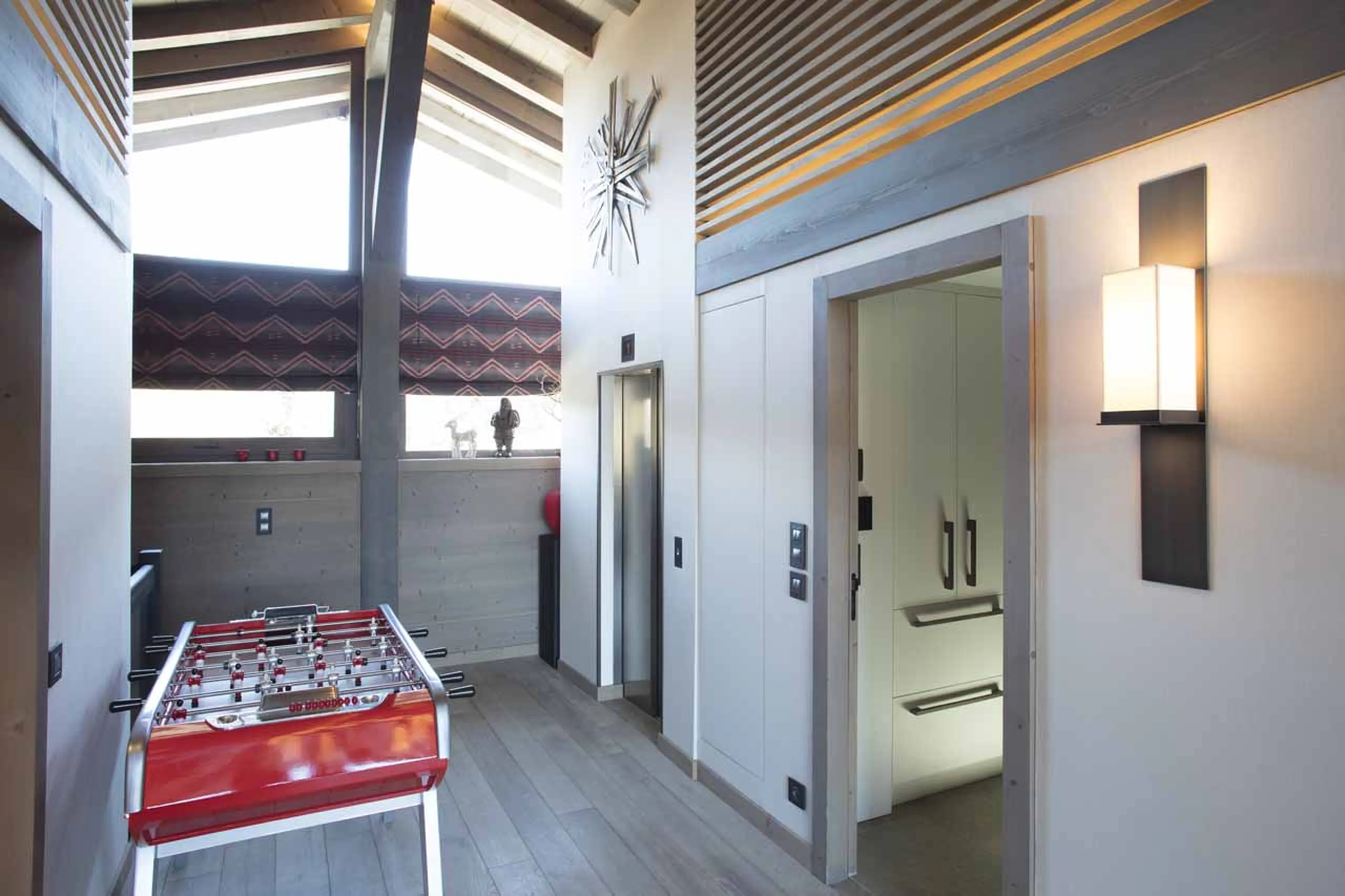 TV and relaxation room at Chalet des Ecureuils in Megeve