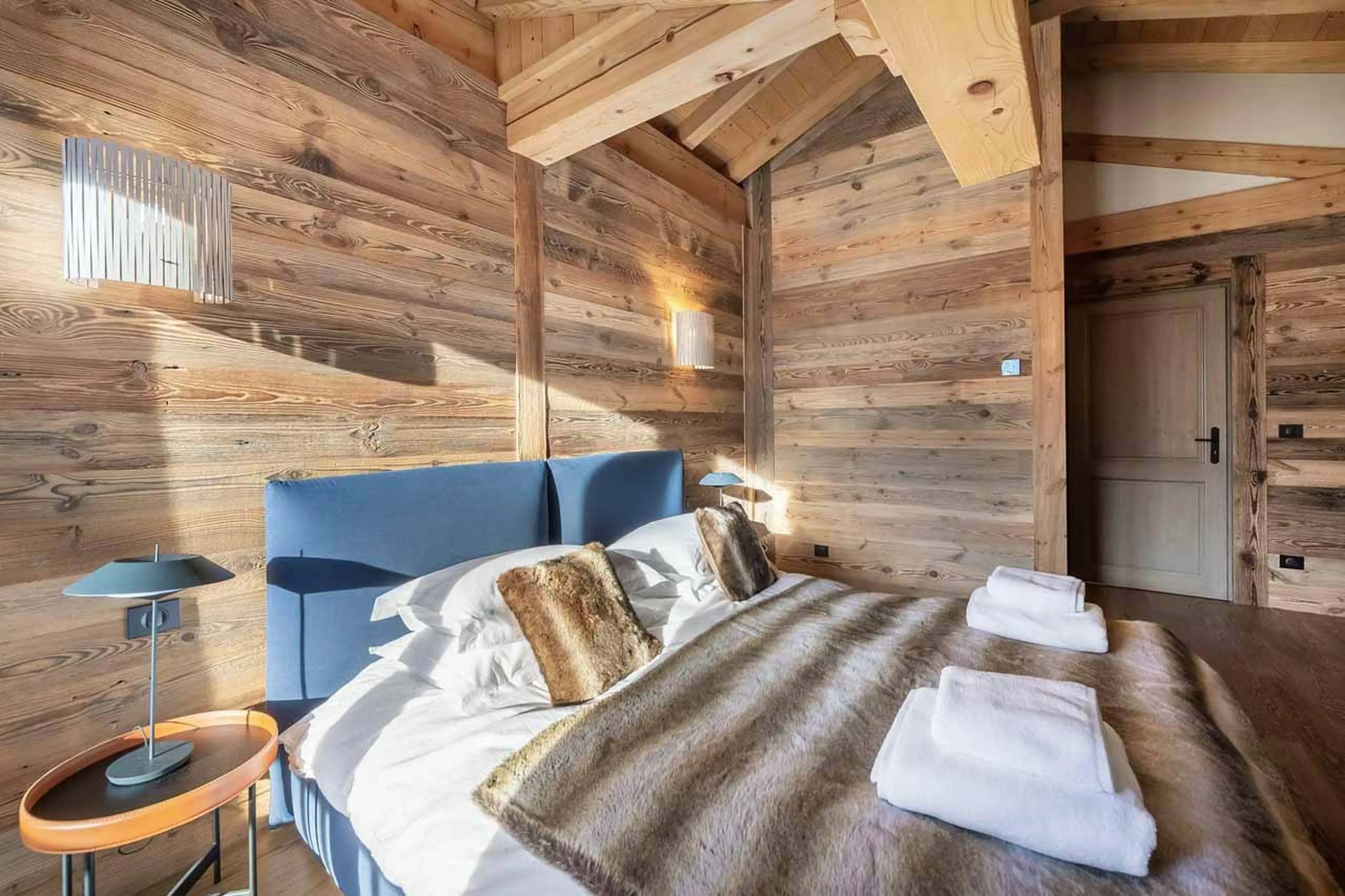 Double bed in master suite at Chalet Duchesse in St Martin de Belleville