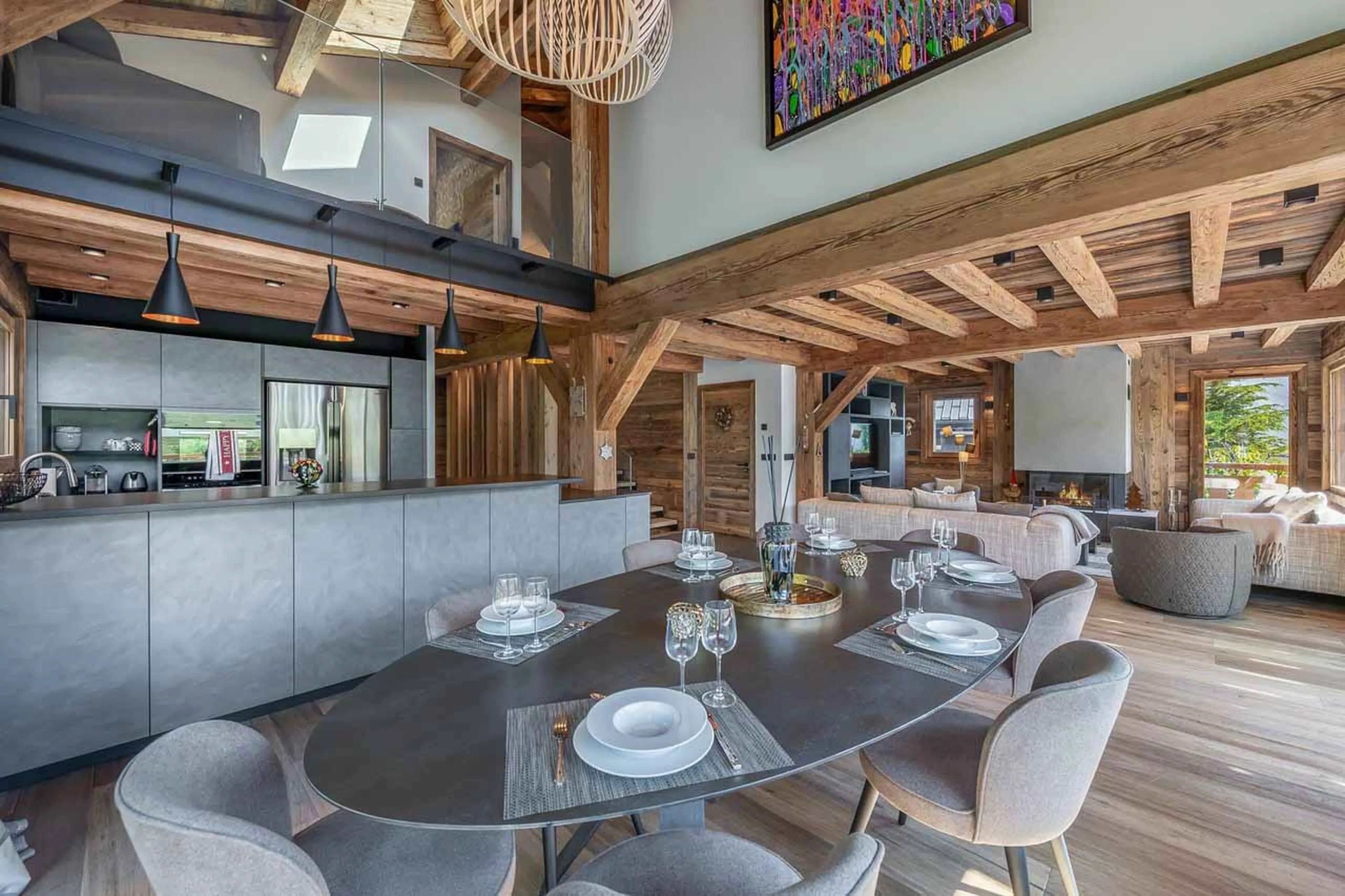 Dining table and kitchen at Chalet Eastwood in Megeve