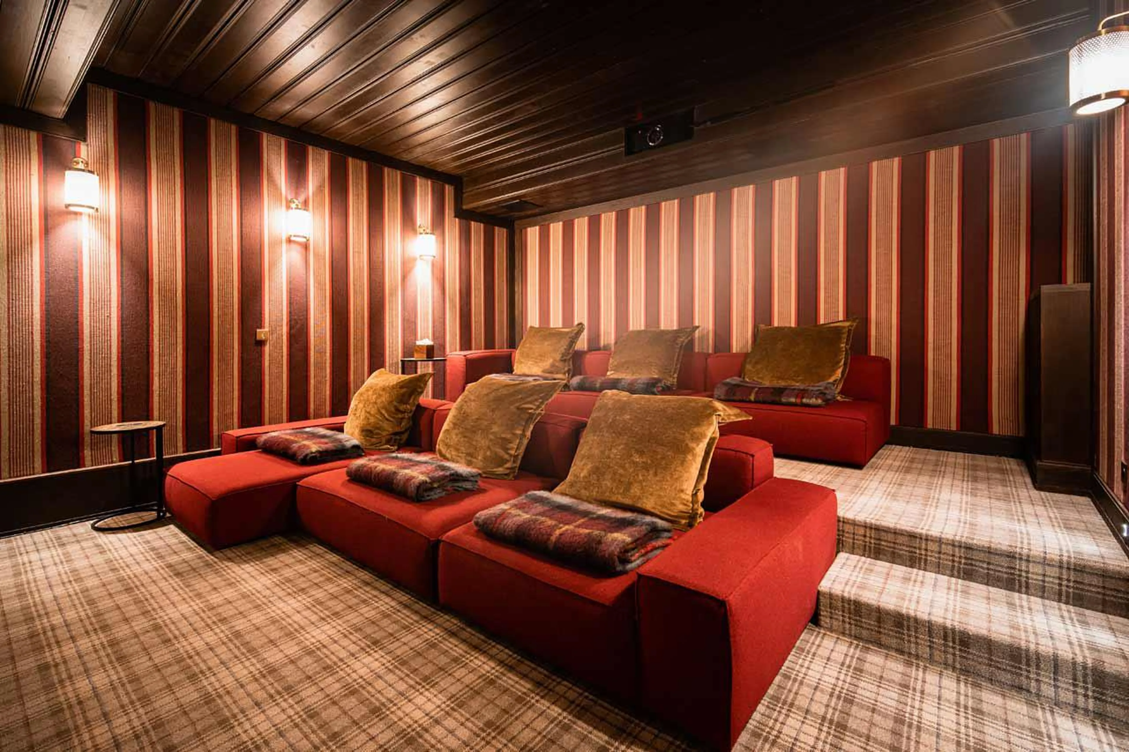 Genuine style cinema room with comfy couches in Chalet Ebene in Val d’ Isere