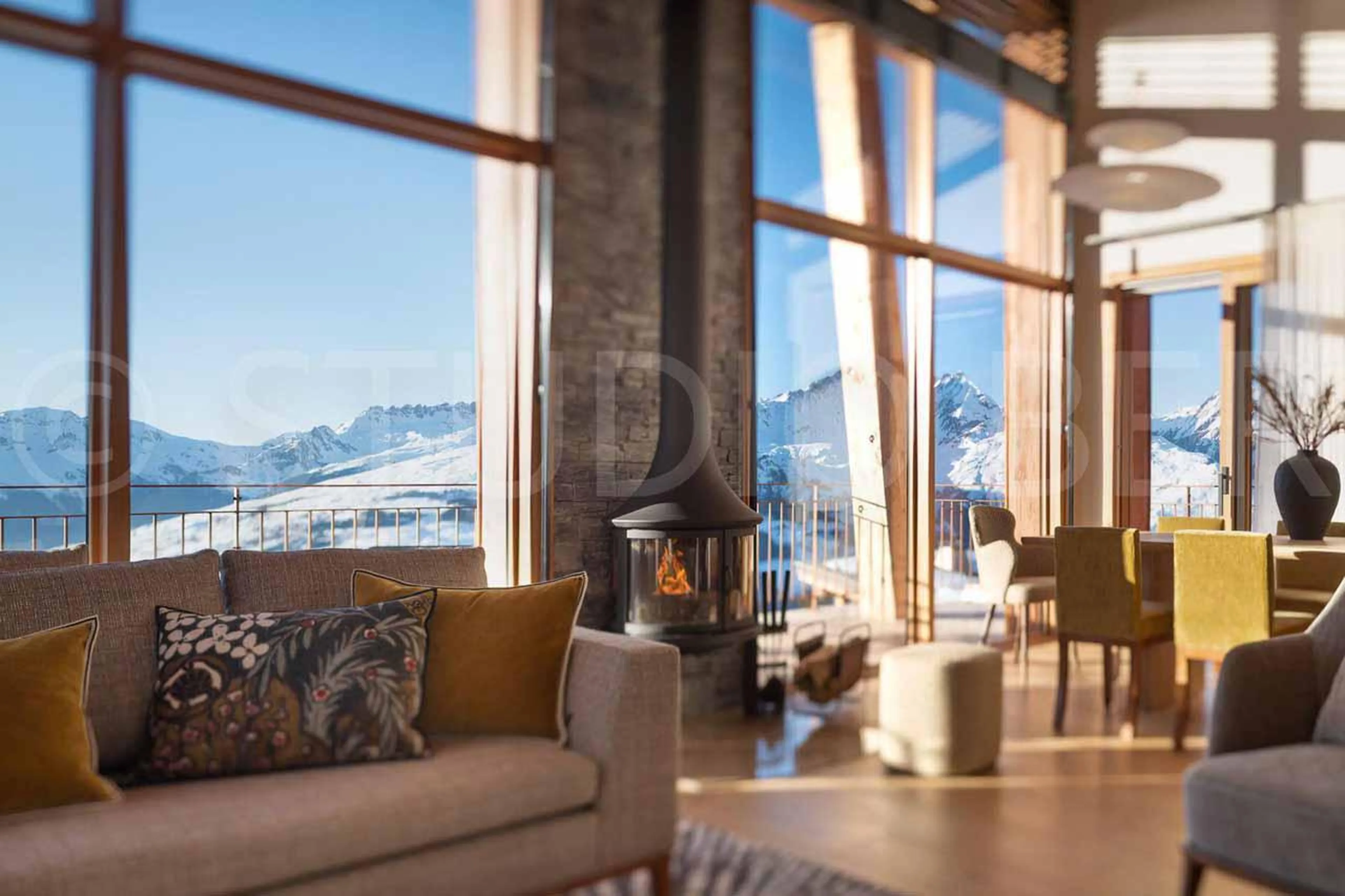 Spacious and warm living area with fireplace at Eden Mille 8 in Les Arcs