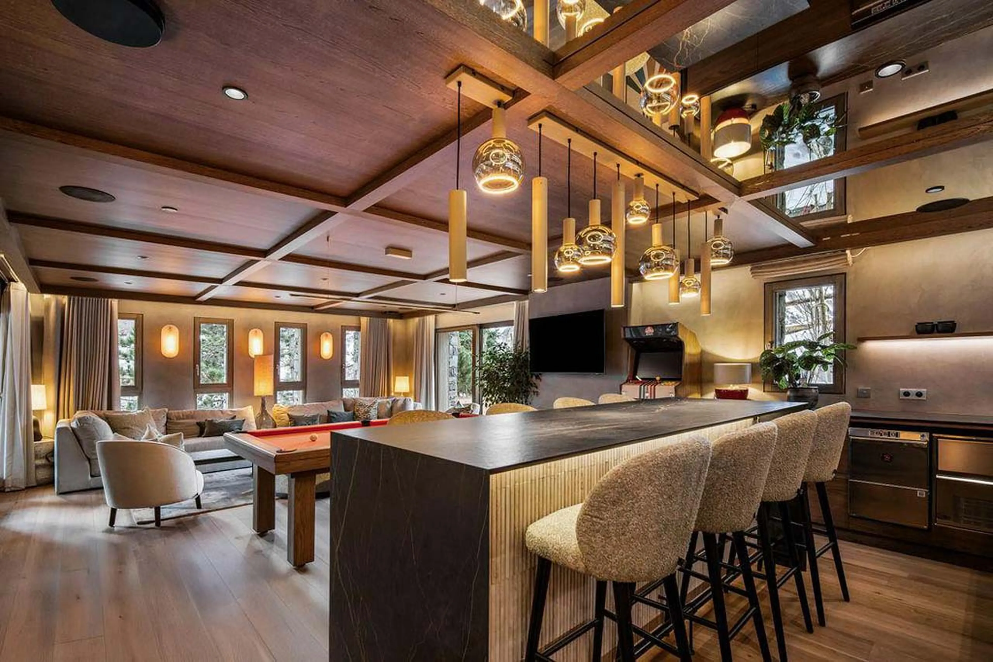 Bar with high seating and pool table in Chalet Escapade, St Martin de Belleville