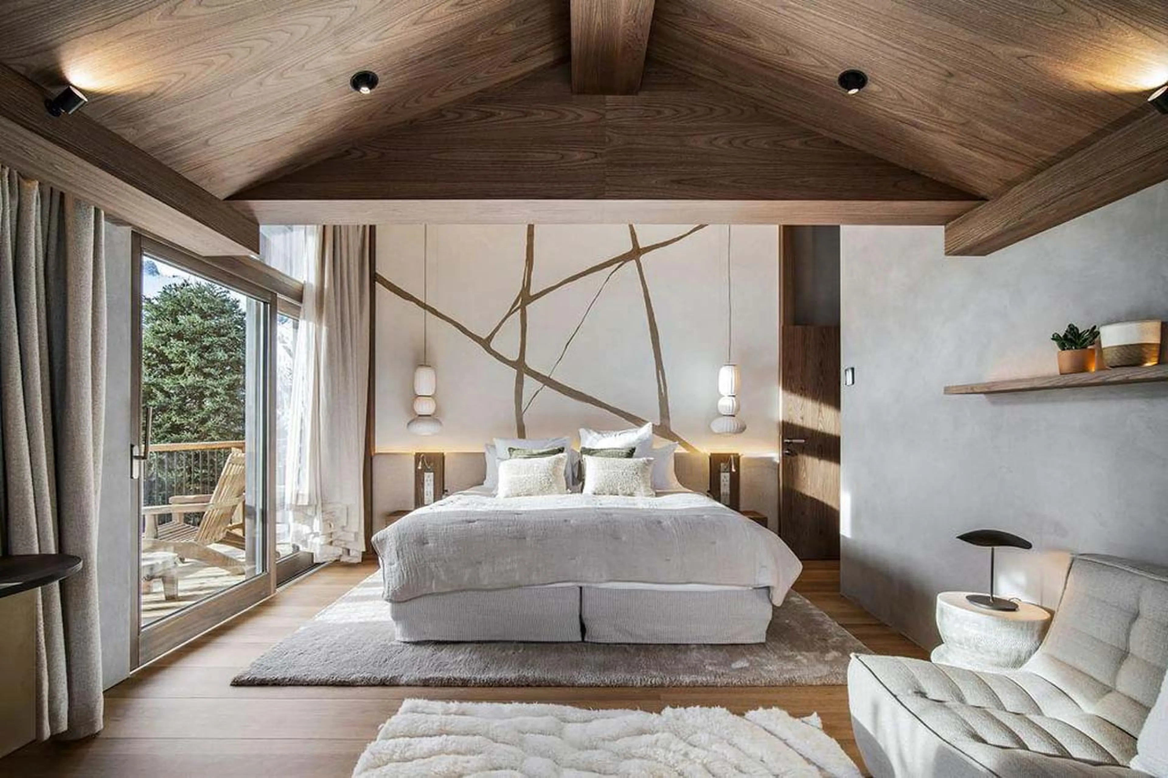 Double bedroom with glass doors in Chalet Escapade, St Martin de Belleville