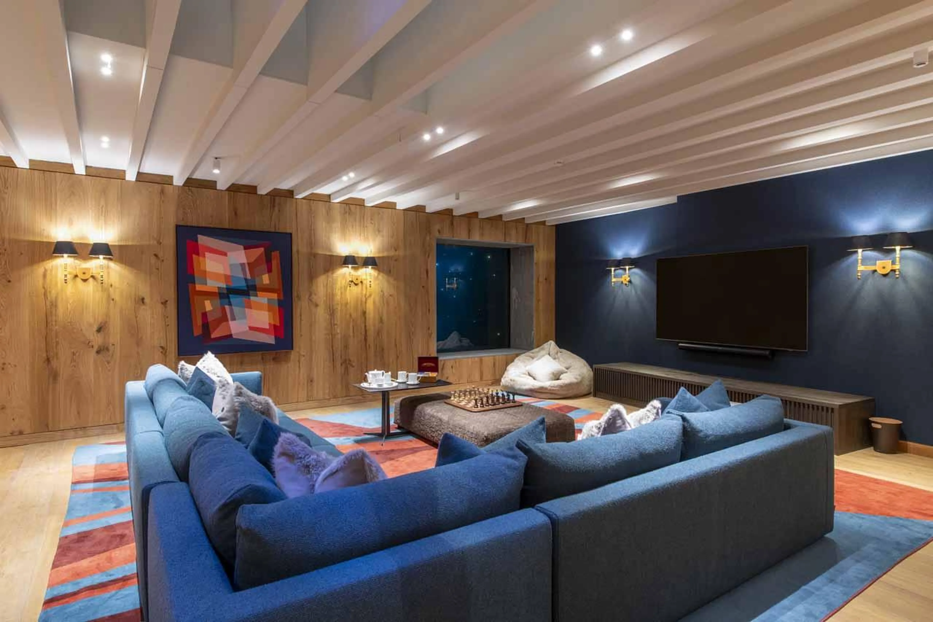 Cinema room with view of swimming pool at Chalet Etoile du Nord - East Wing in Val d'Isere