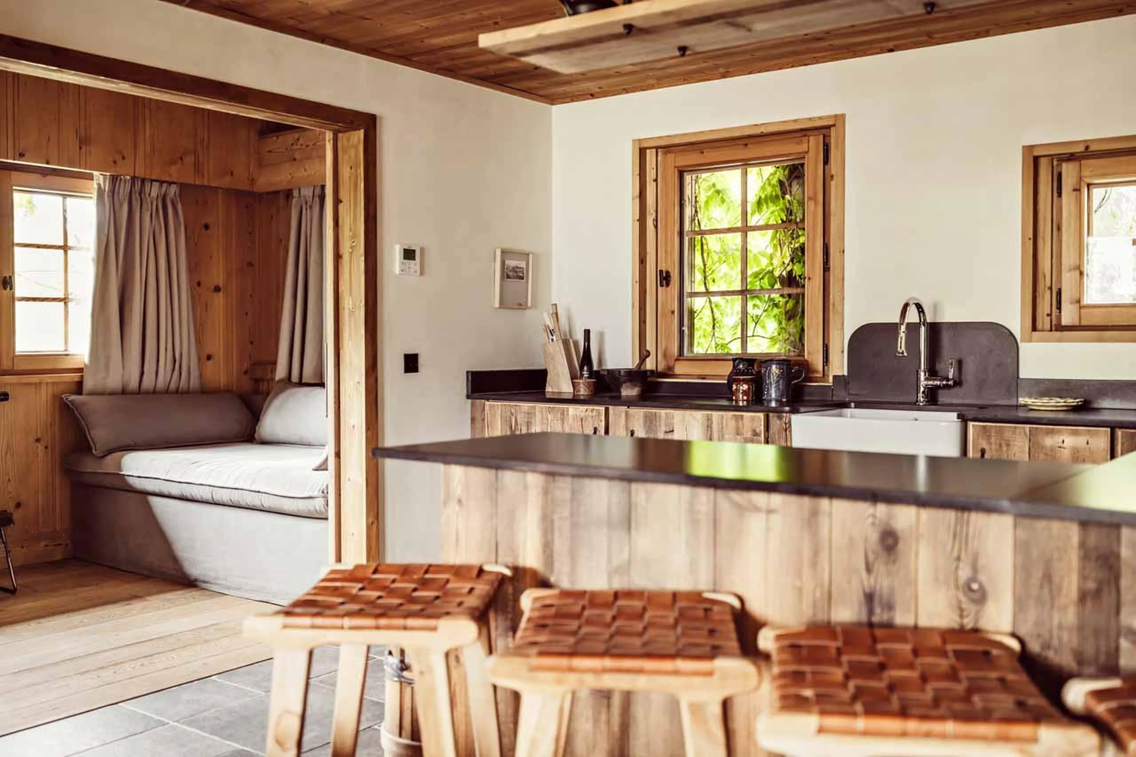 Kitchen with wooden facade and island in Chalet Eustache, Megeve