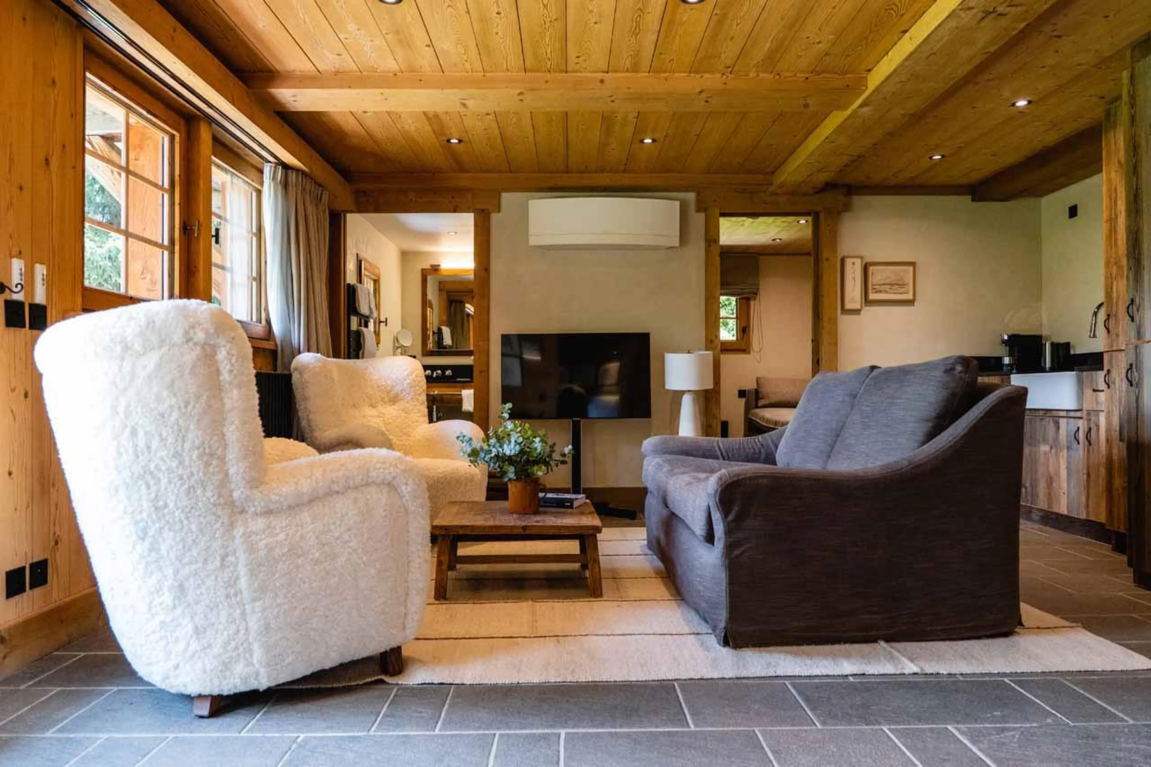 Living area in studio with armchairs and sofa in Chalet Eustache, Megeve
