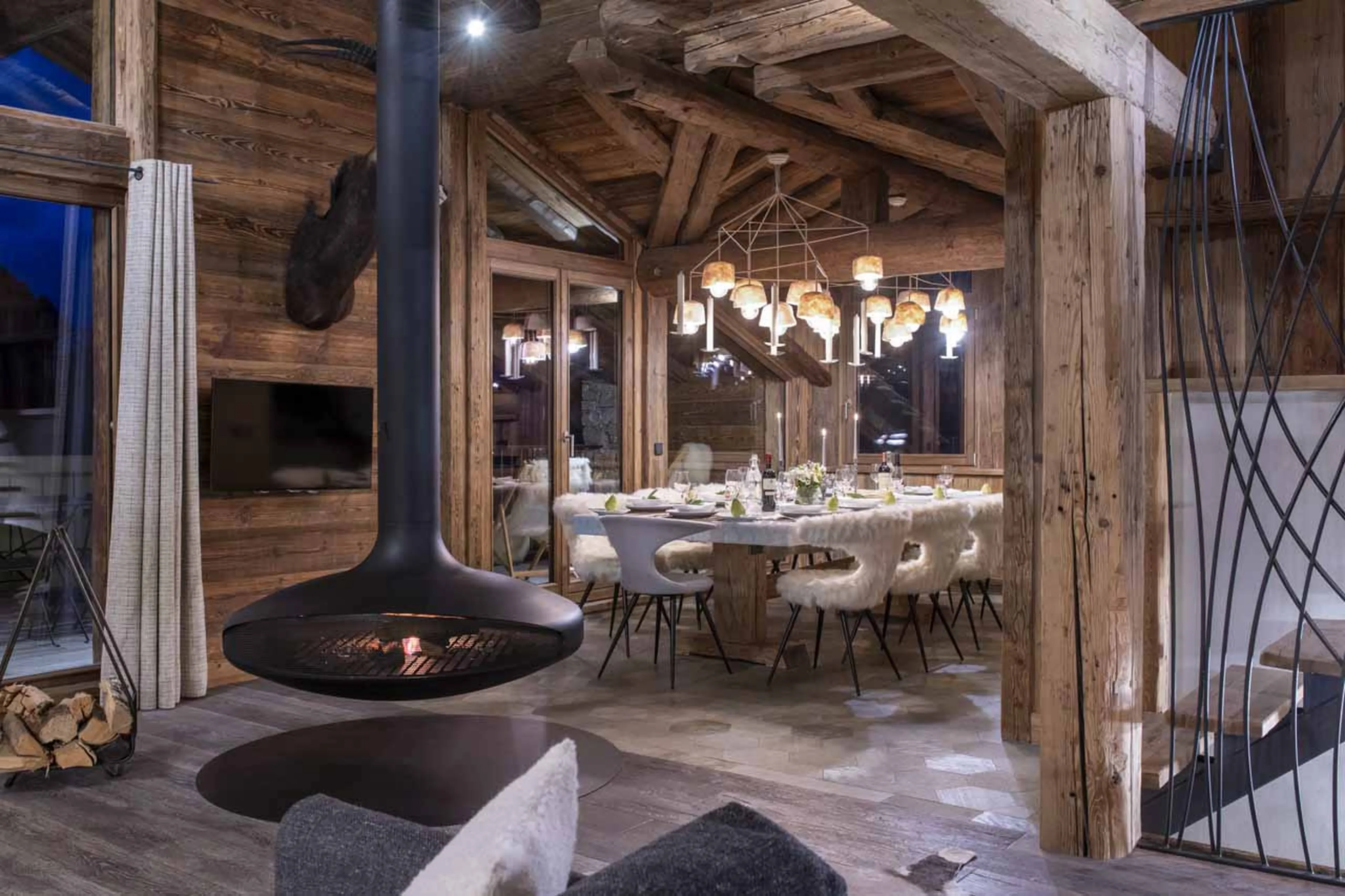 Fireplace and elegant dining area at Chalet Face a Face in Val d'Isere