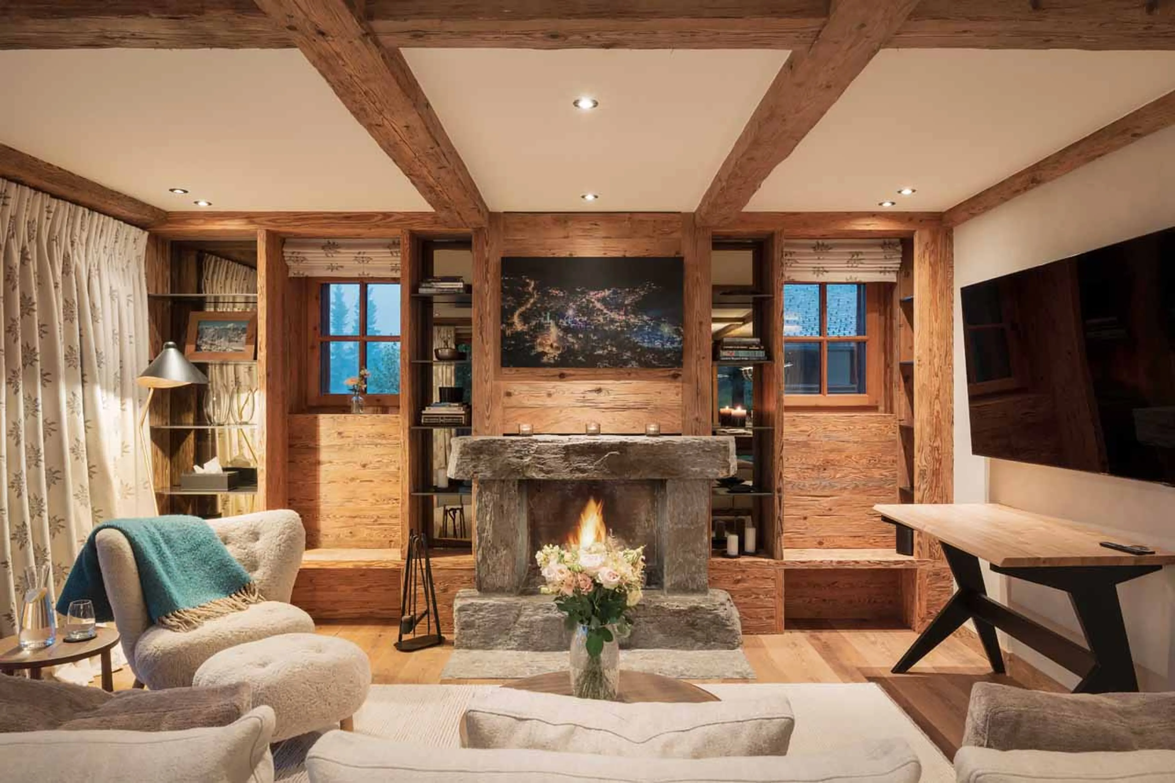 Fireplace in living area of Chalet Feuillu in Verbier