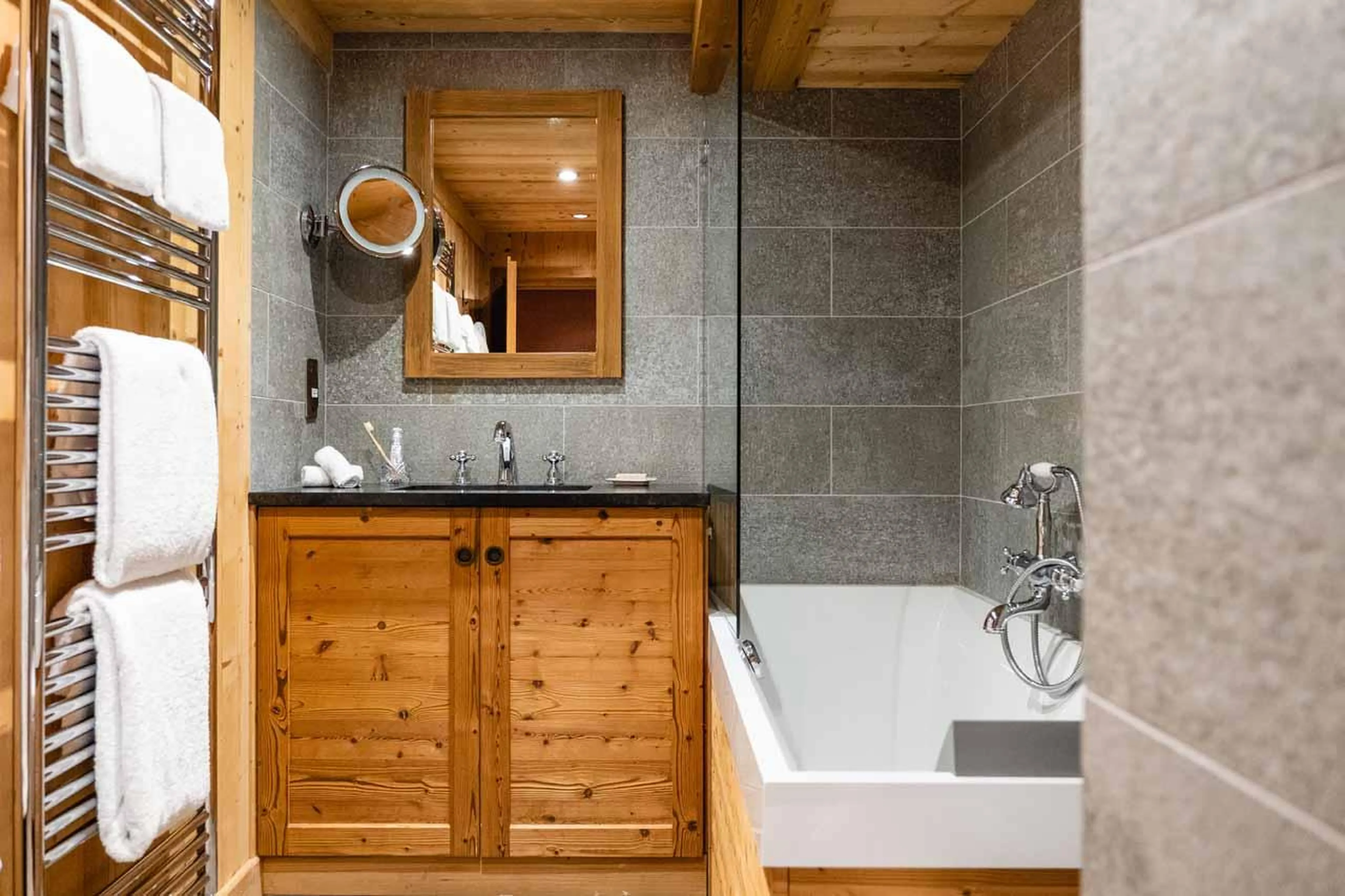 En-suite bathroom with bathtub and basin in Chalet Firmin, Megeve