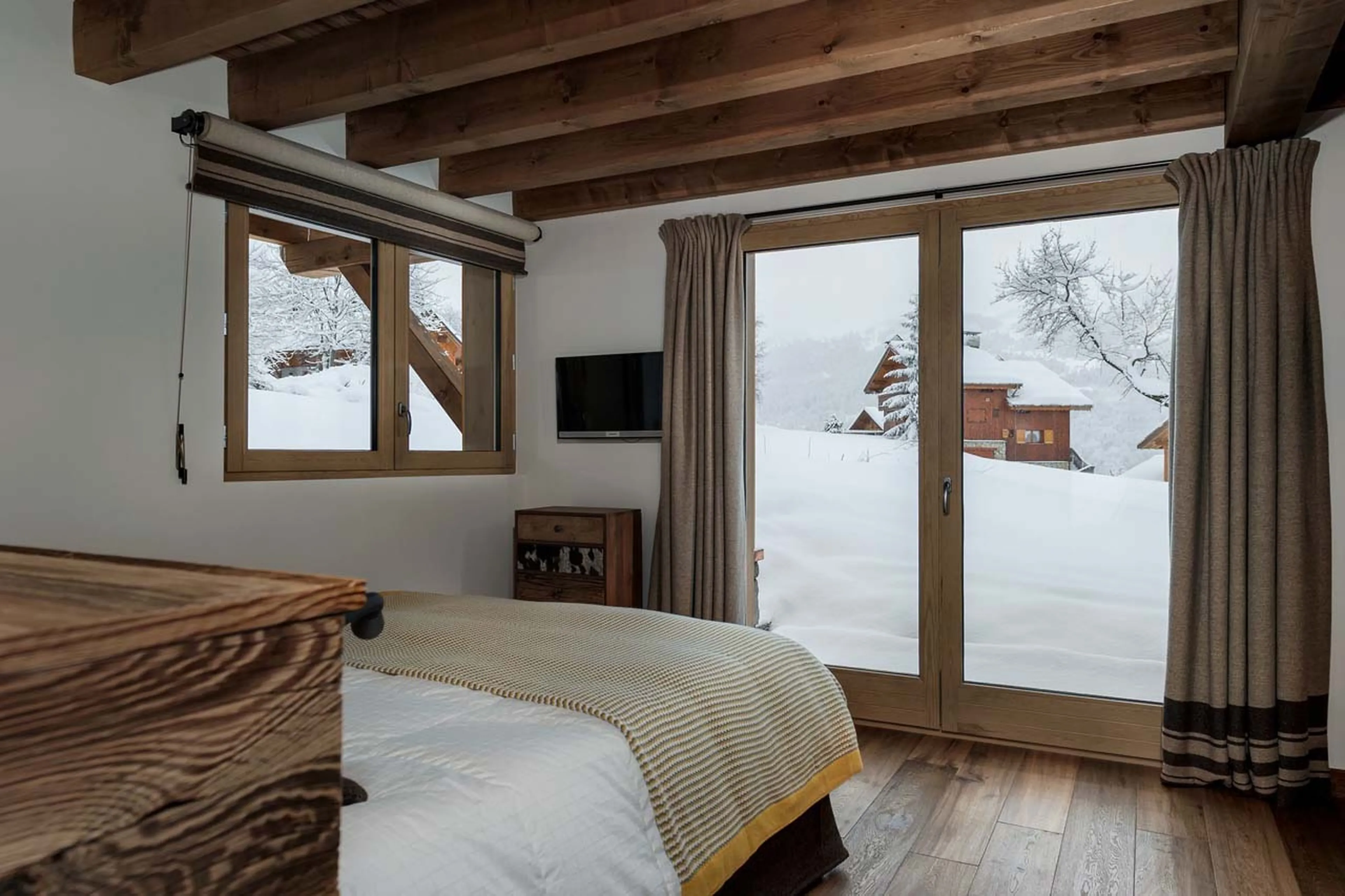 Tv in bedroom one at Chalet Fontany in Meribel