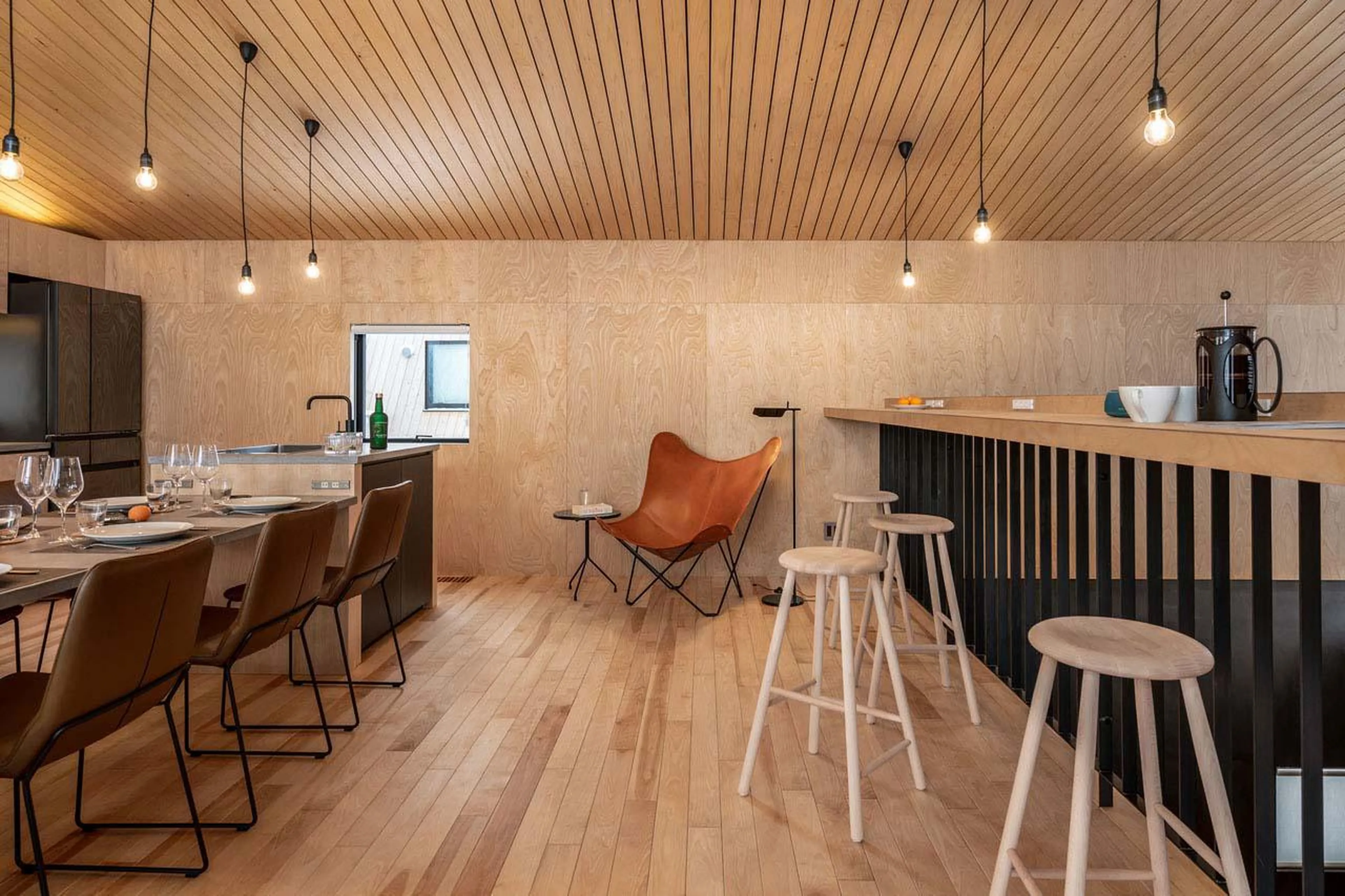 Dining table and breakfast bar at Chalet Foxwood B in Niseko