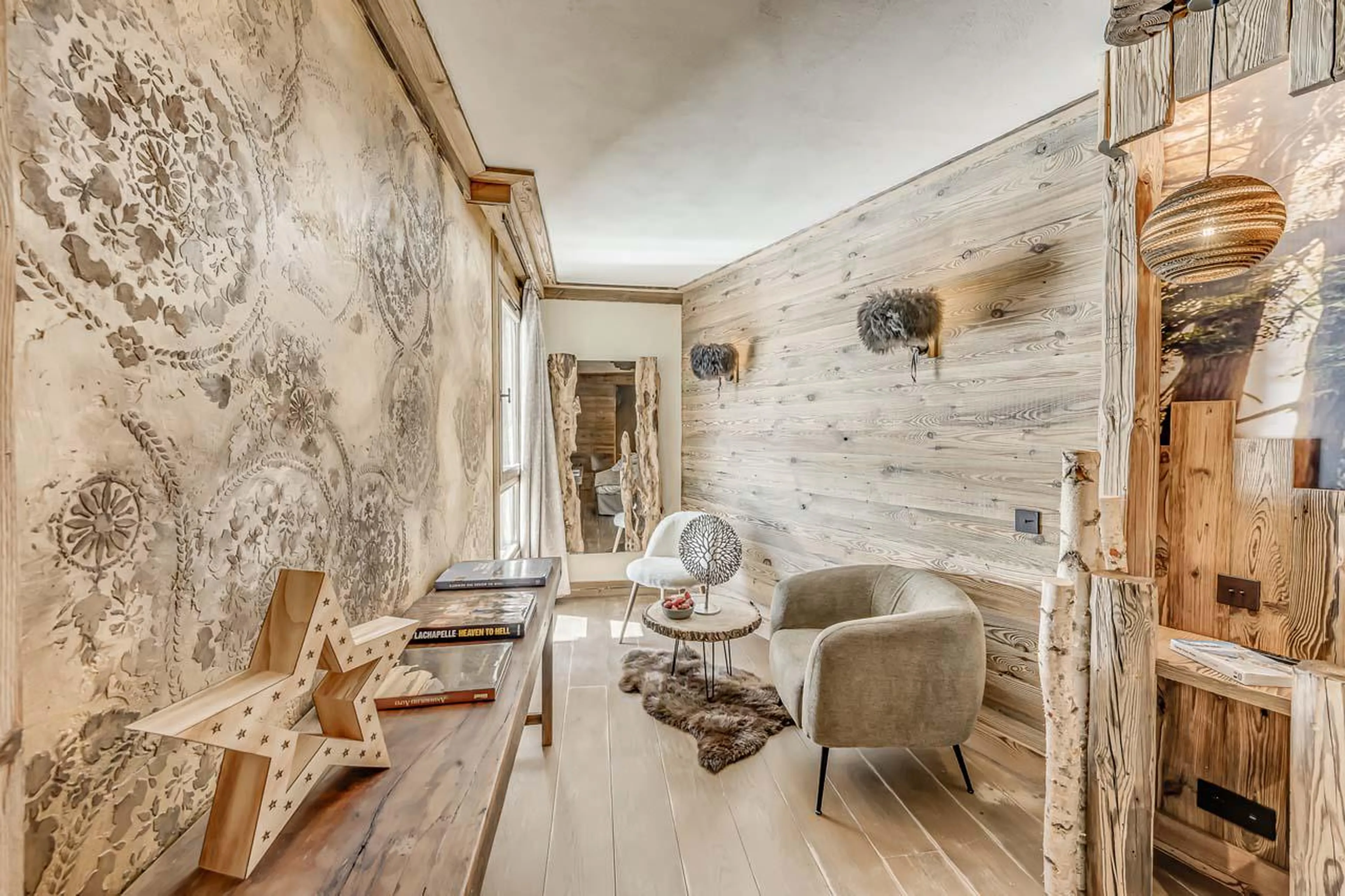 Tasteful seating area overlooking south facing window at Chalet Ganga in Tignes