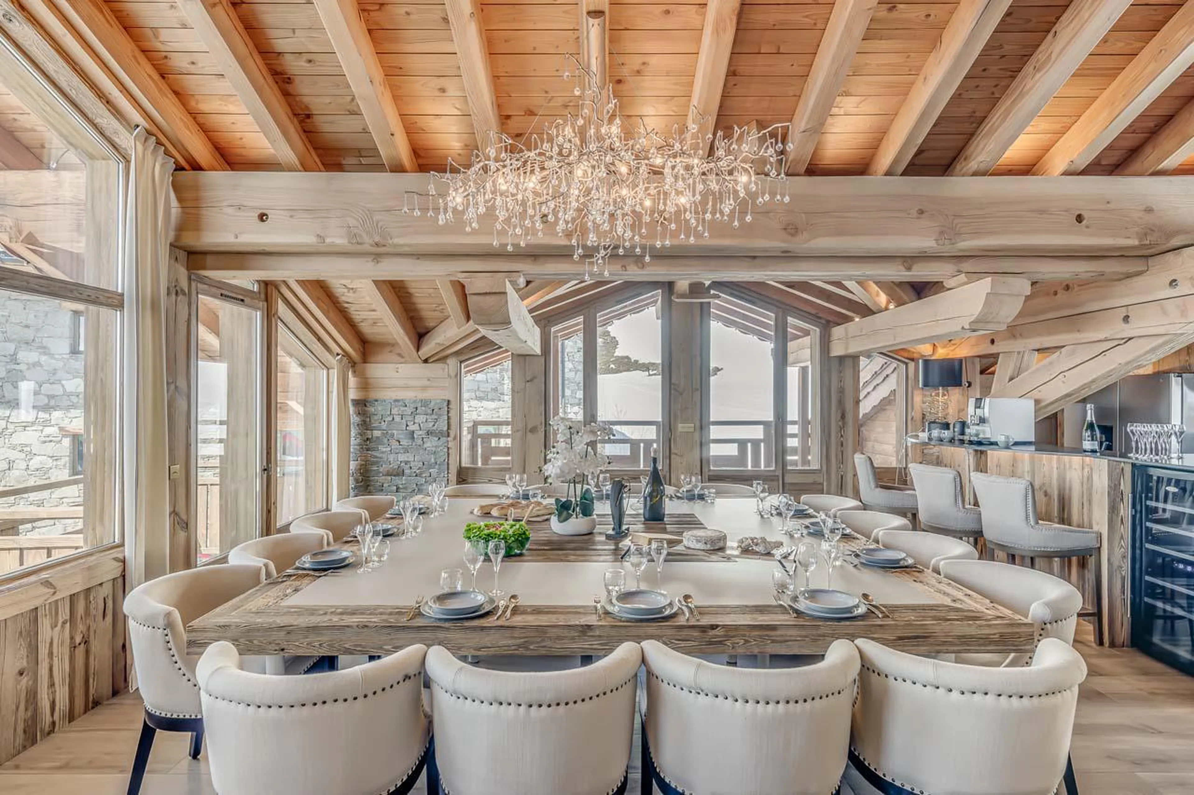 Dining area with access to both south and west facing balconies at Chalet Ganga in Tignes