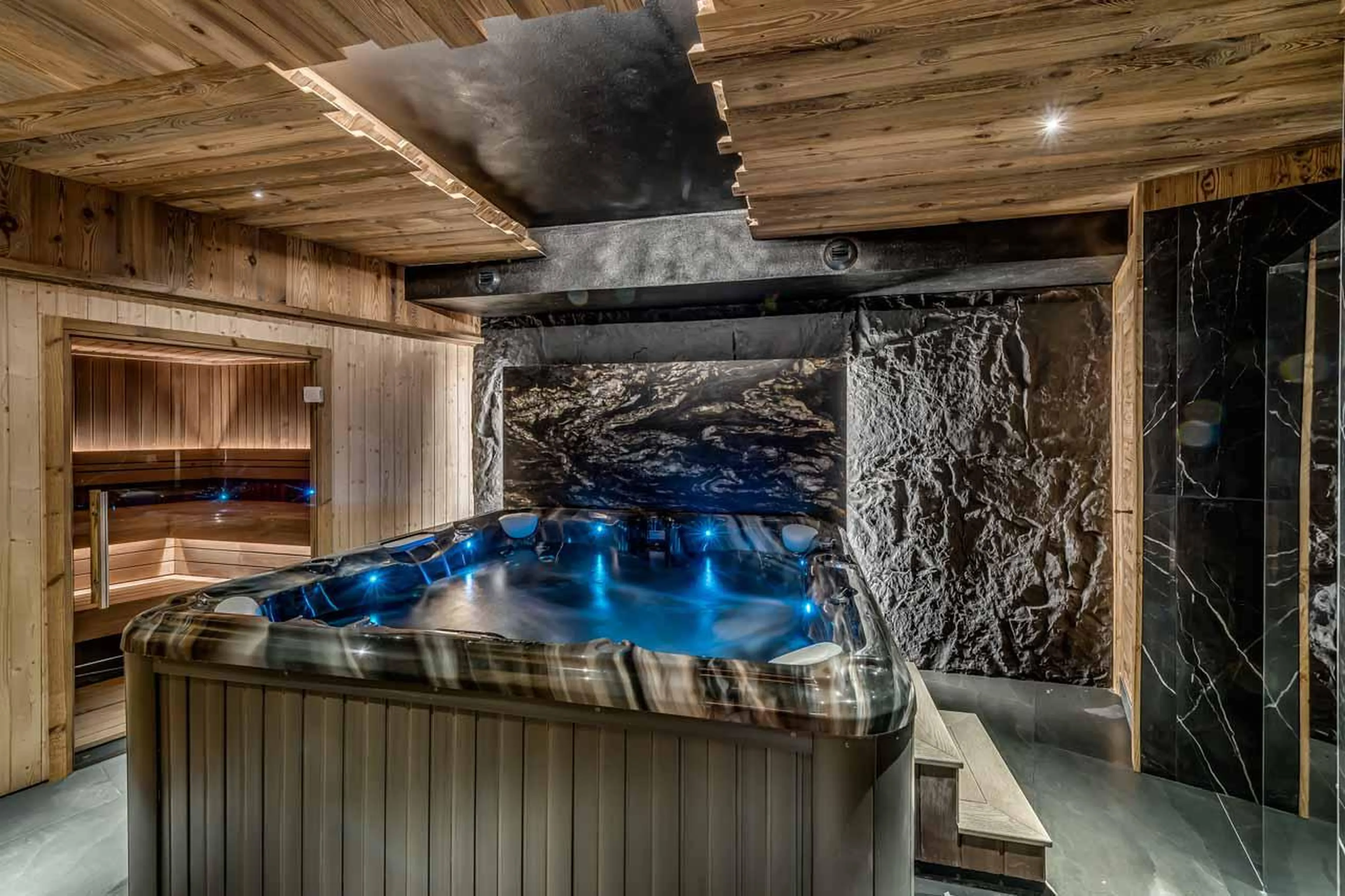 Tranquil spa area with hot tub and sauna at Chalet Ganga in Tignes
