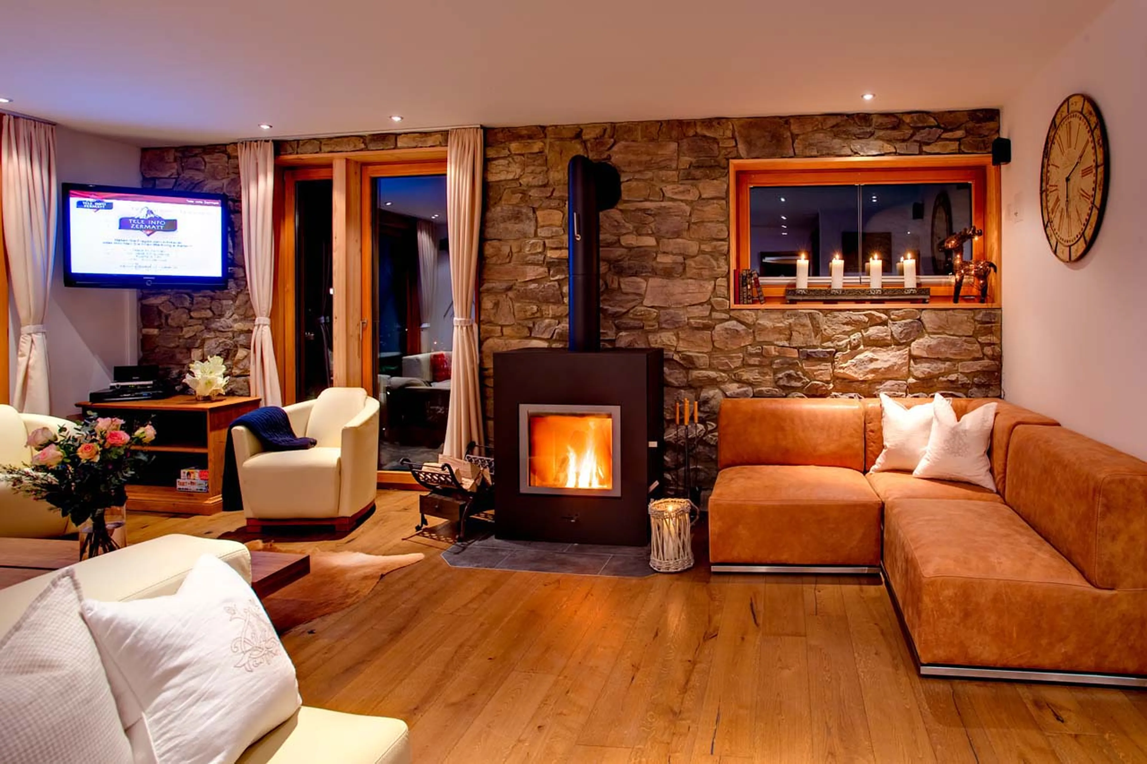 Wood burning stove and flat screen TV at Chalet Gemini in Zermatt
