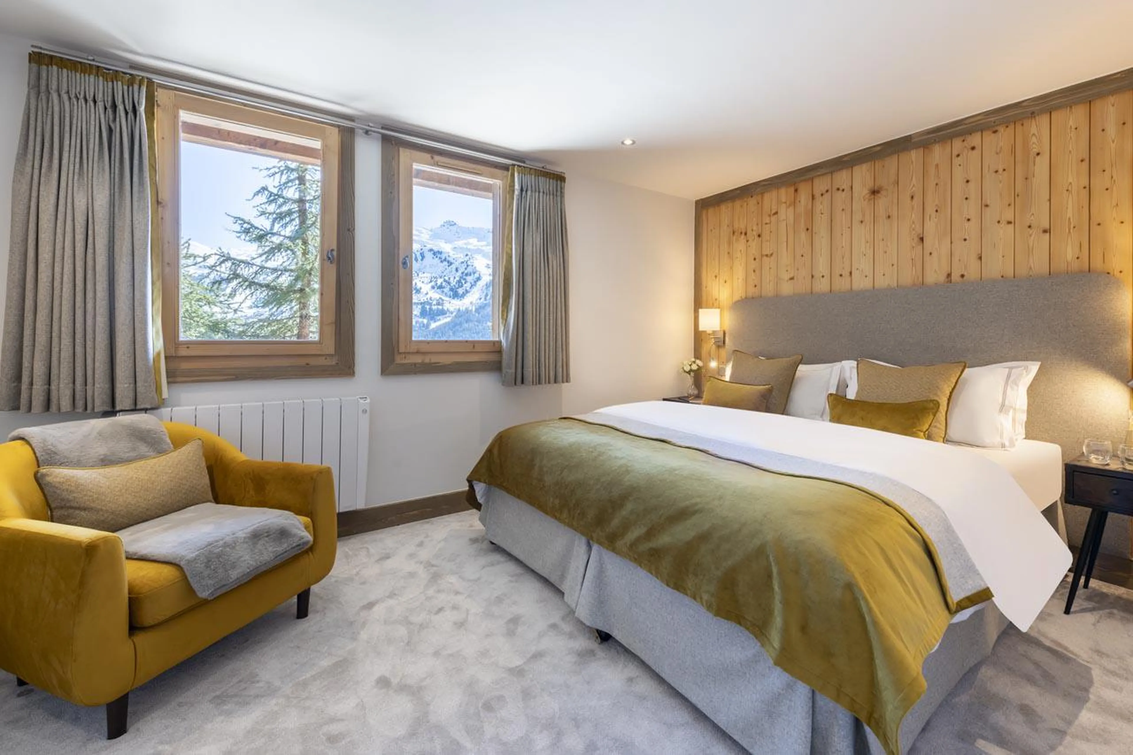 Double/twin bedroom with en-suite shower room at Chalet Genepi in Meribel