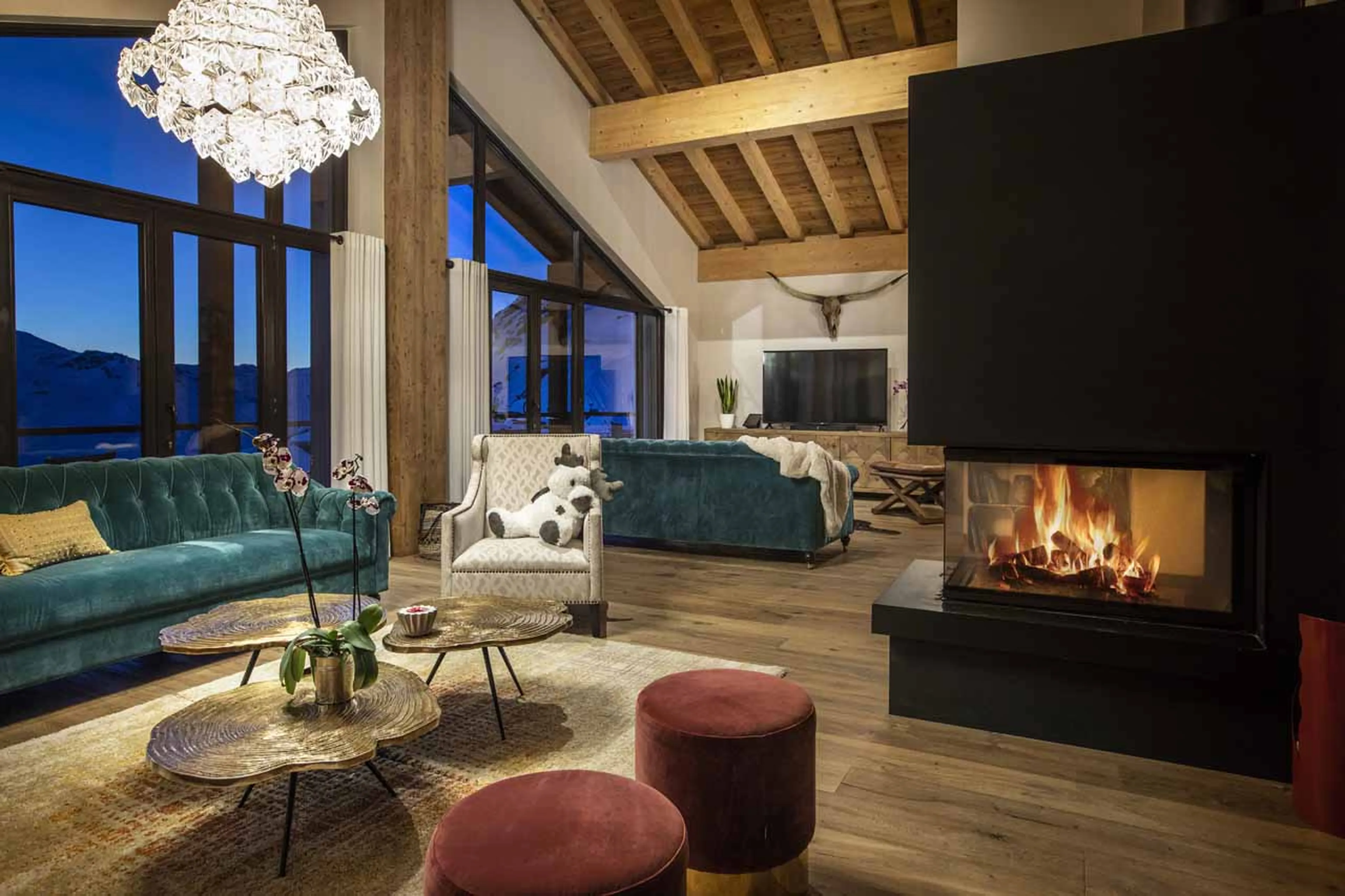 Fireplace in living area of Chalet Golden Jubilee in Val Thorens
