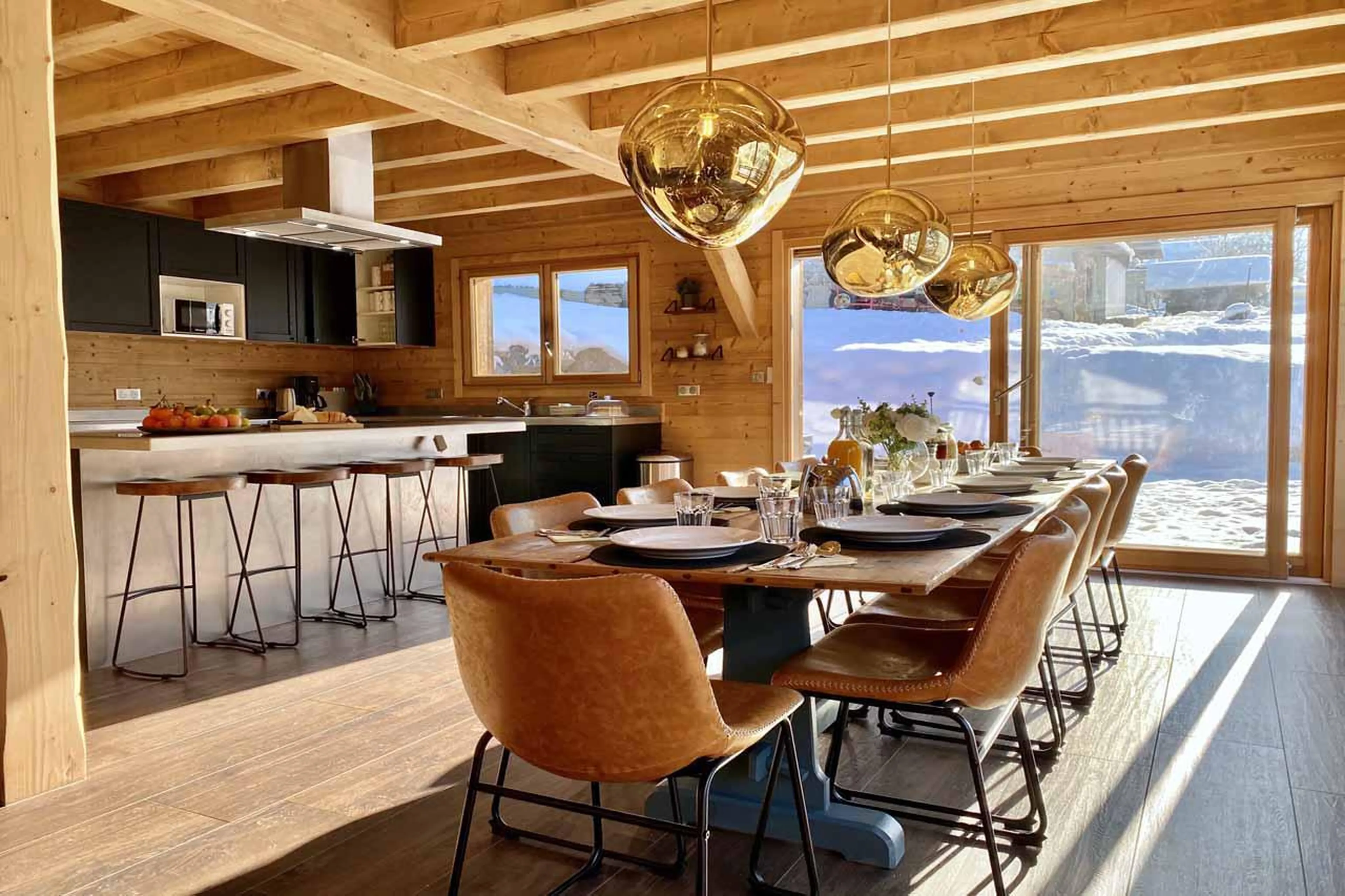 Dining table and kitchen island at Chalet Gouter in Morzine