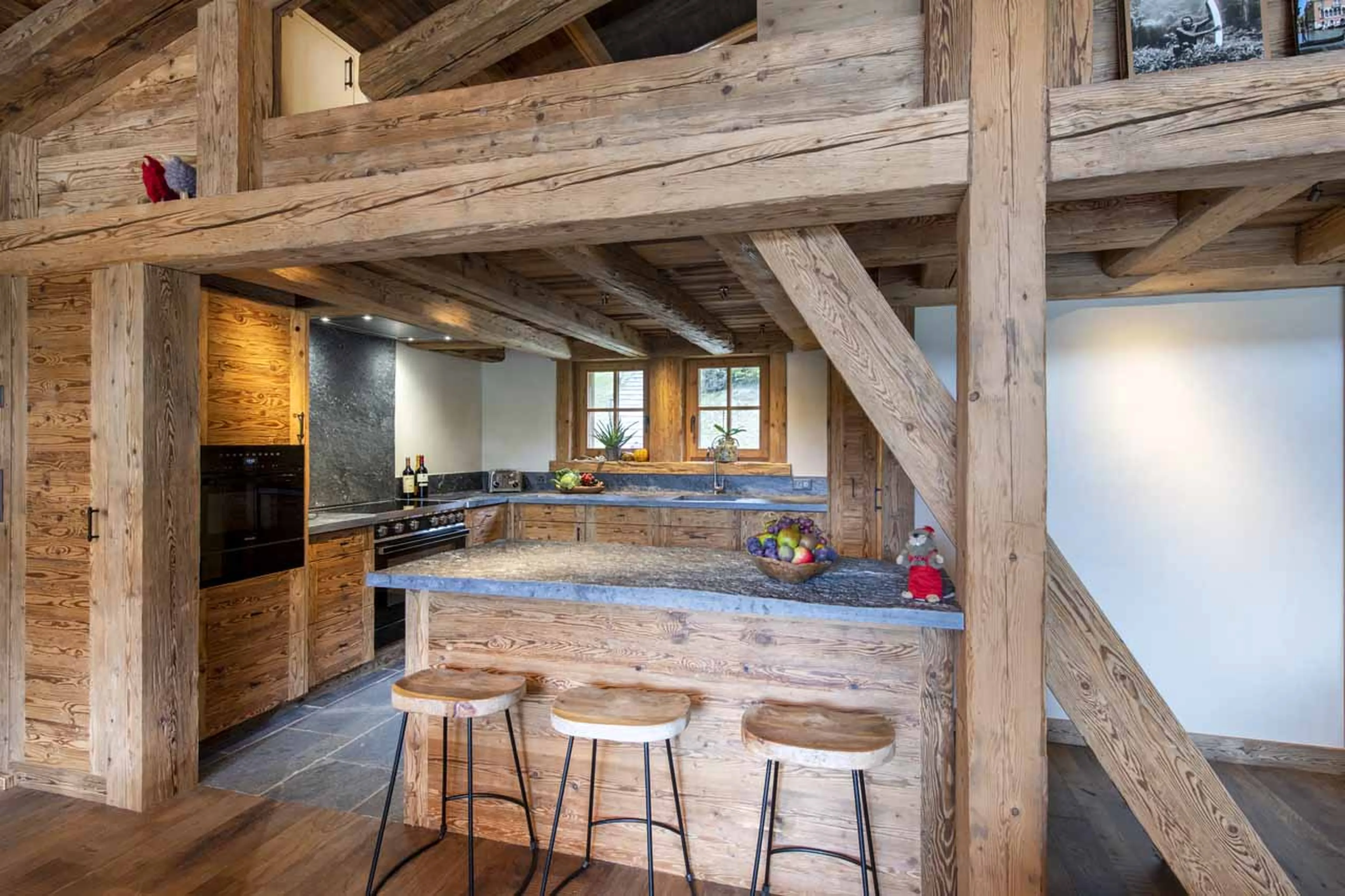 Kitchen with breakfast bar at Chalet Grand Coeur in Verbier