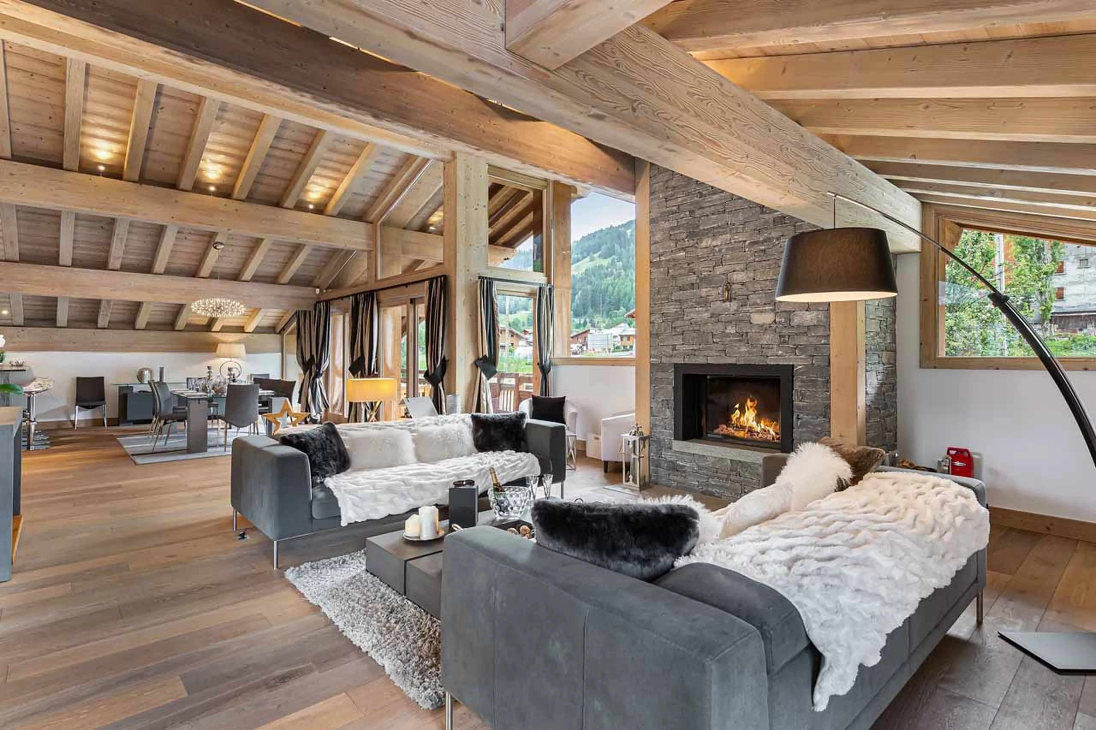 Fireplace in living area at Chalet Grand Tetras at Courchevel Le Praz