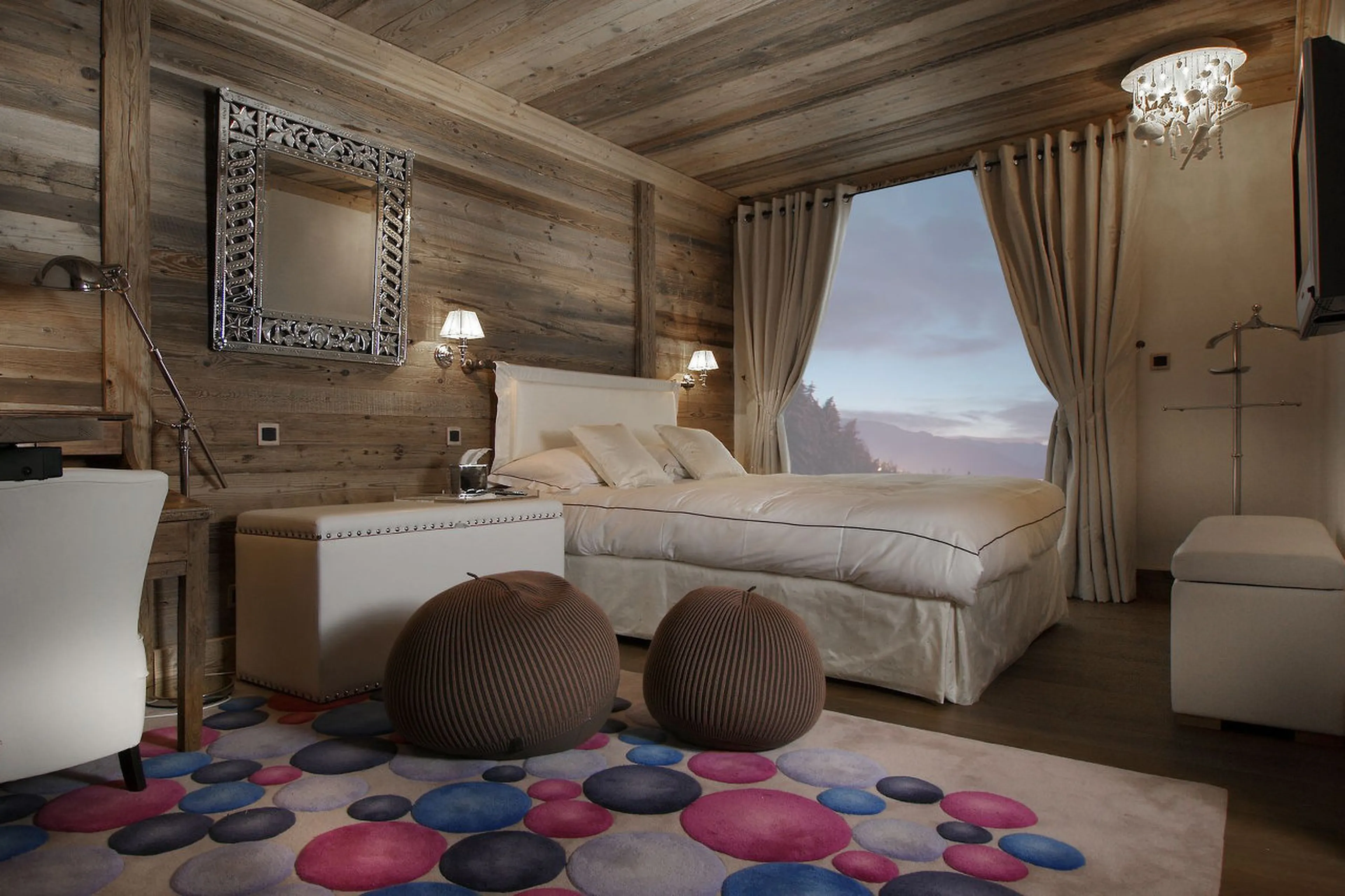 Bedroom with double bed and access to the balcony of Chalet La Grande Roche in Courchevel 1850