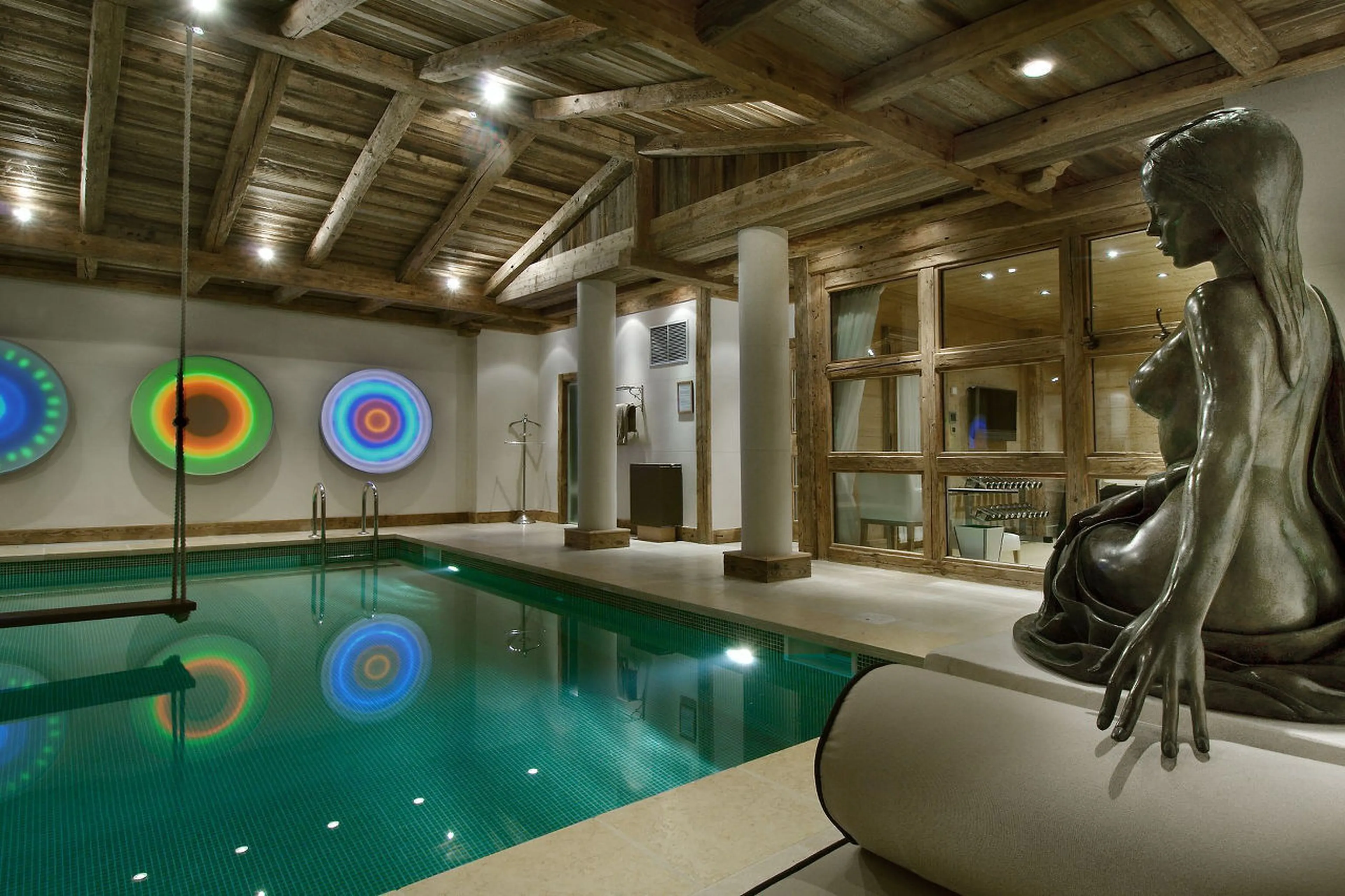 A mermaid overlooks all that happens in the pool in Chalet La Grande Roche in Courchevel 1850