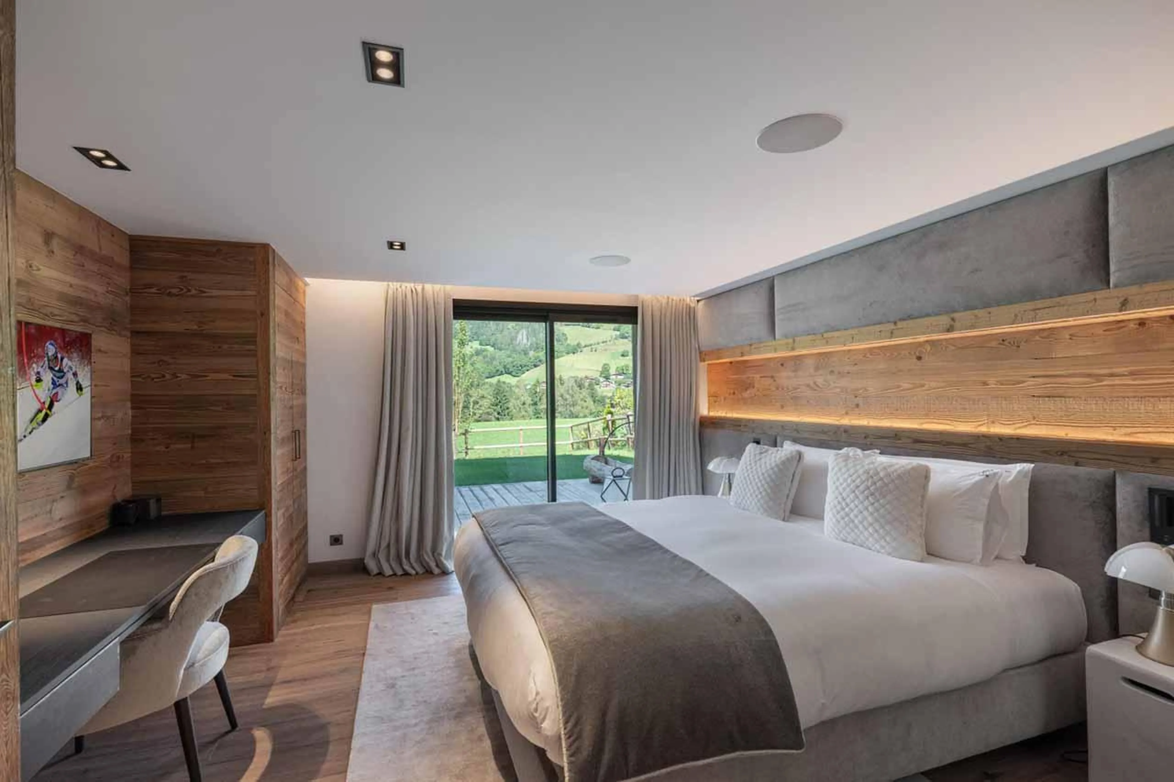 Double bedroom with sliding glass doors in Chalet Grizzly, Megeve