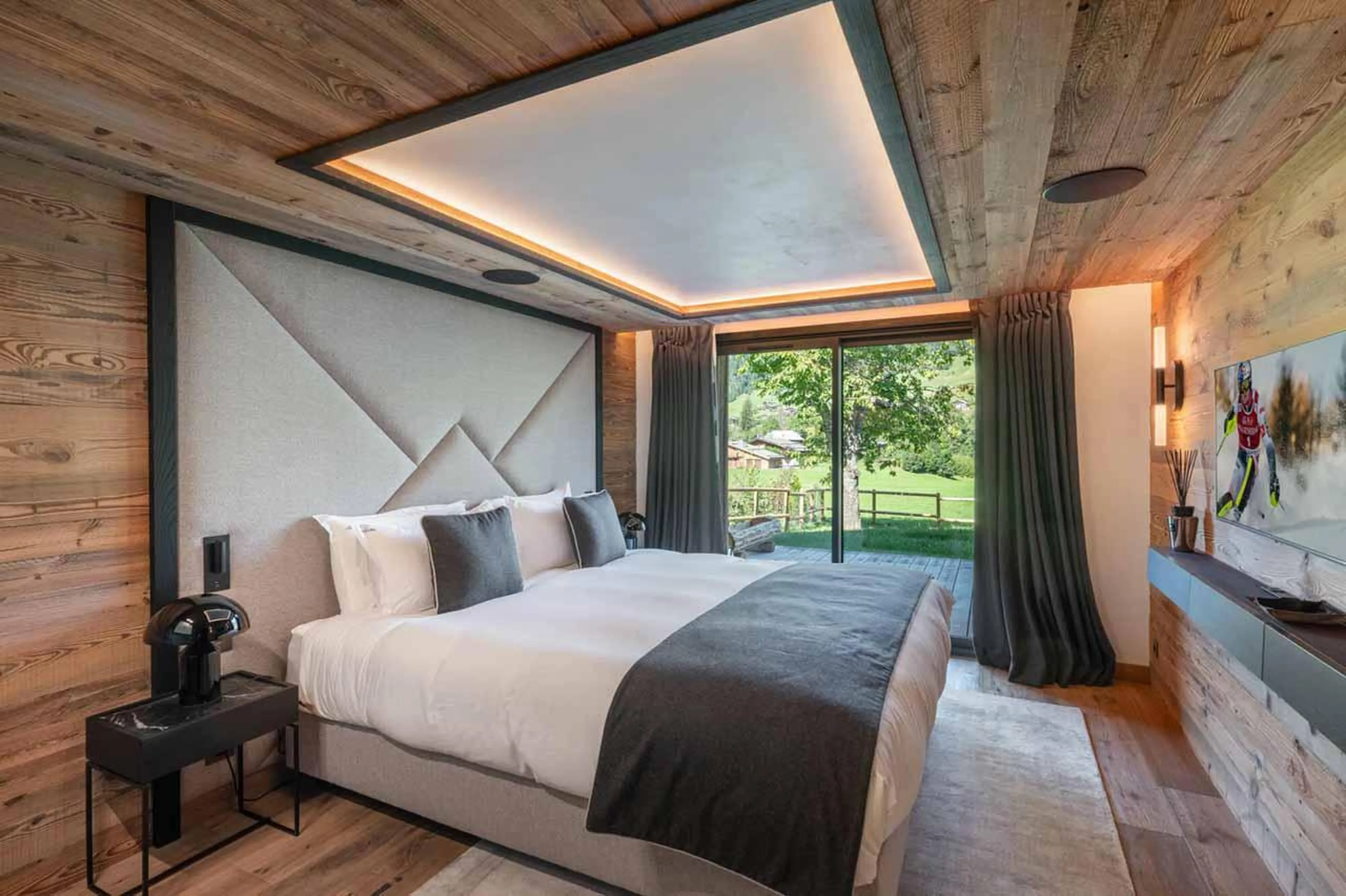 Double bedroom with sliding glass doors in Chalet Grizzly, Megeve