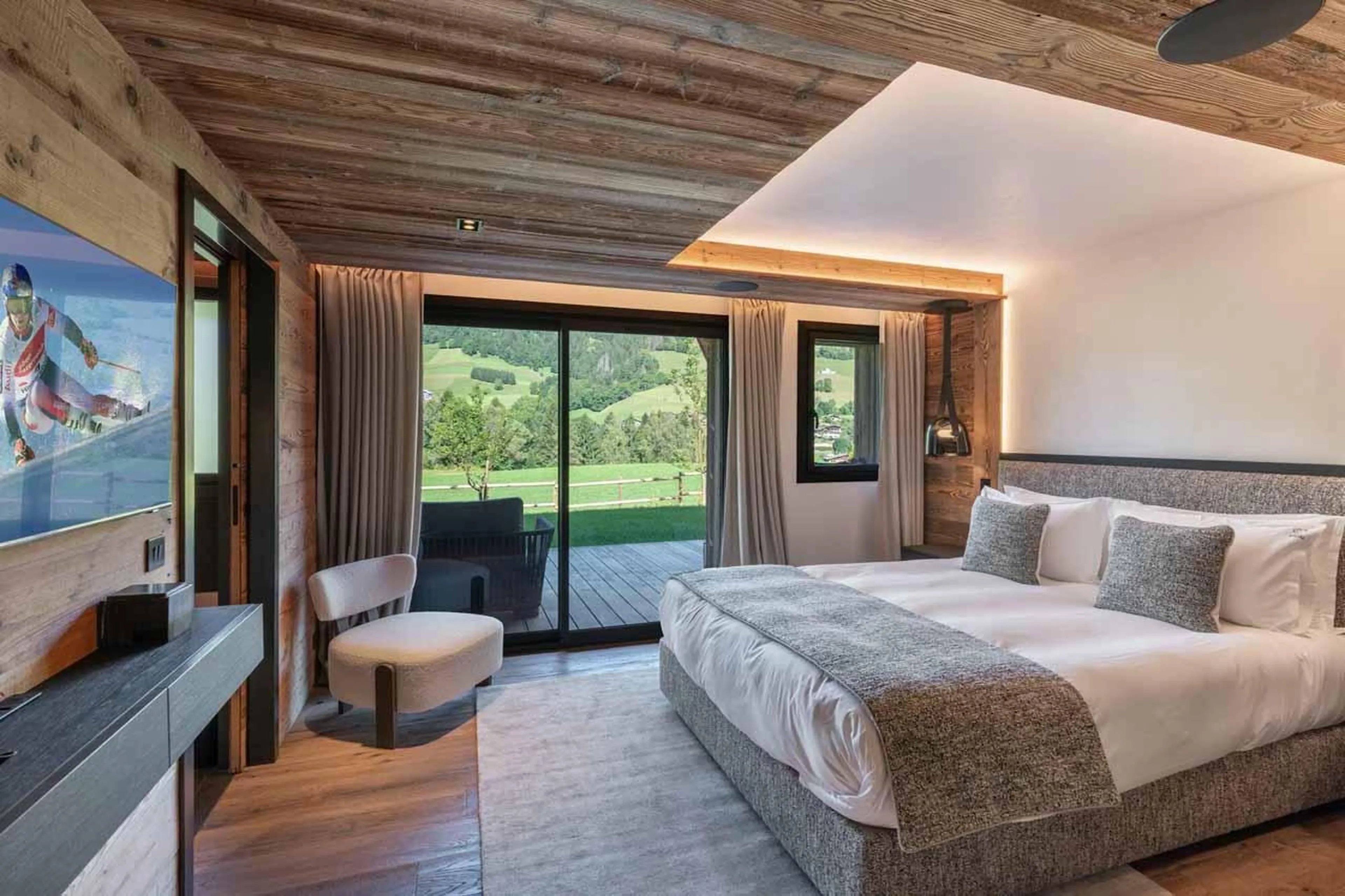 Double bedroom with sliding glass doors in Chalet Grizzly, Megeve